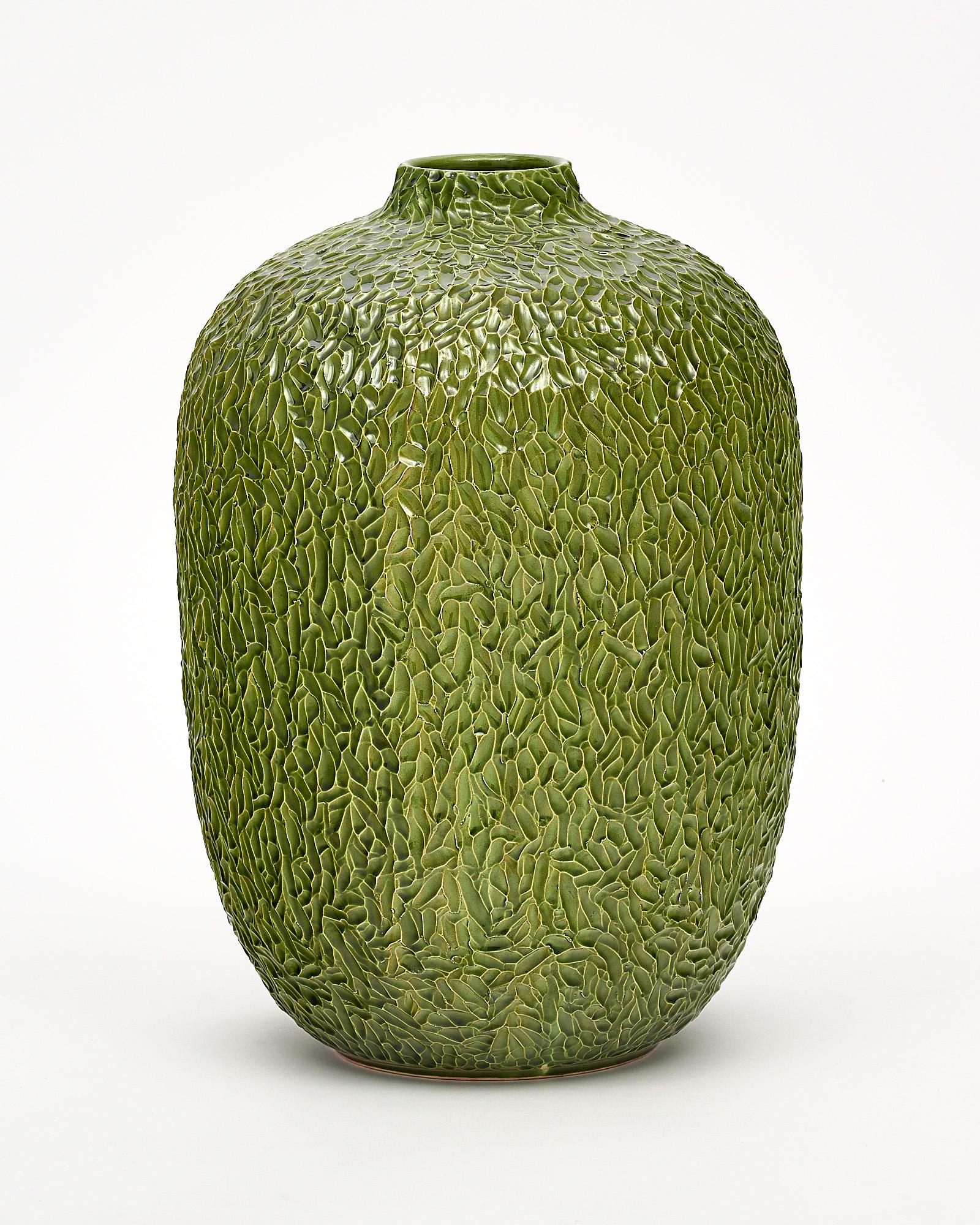 Vase, Italian, made of glazed ceramic and featuring a delicate leaf pattern imprint. This hand-crafted piece has a unique warmth.