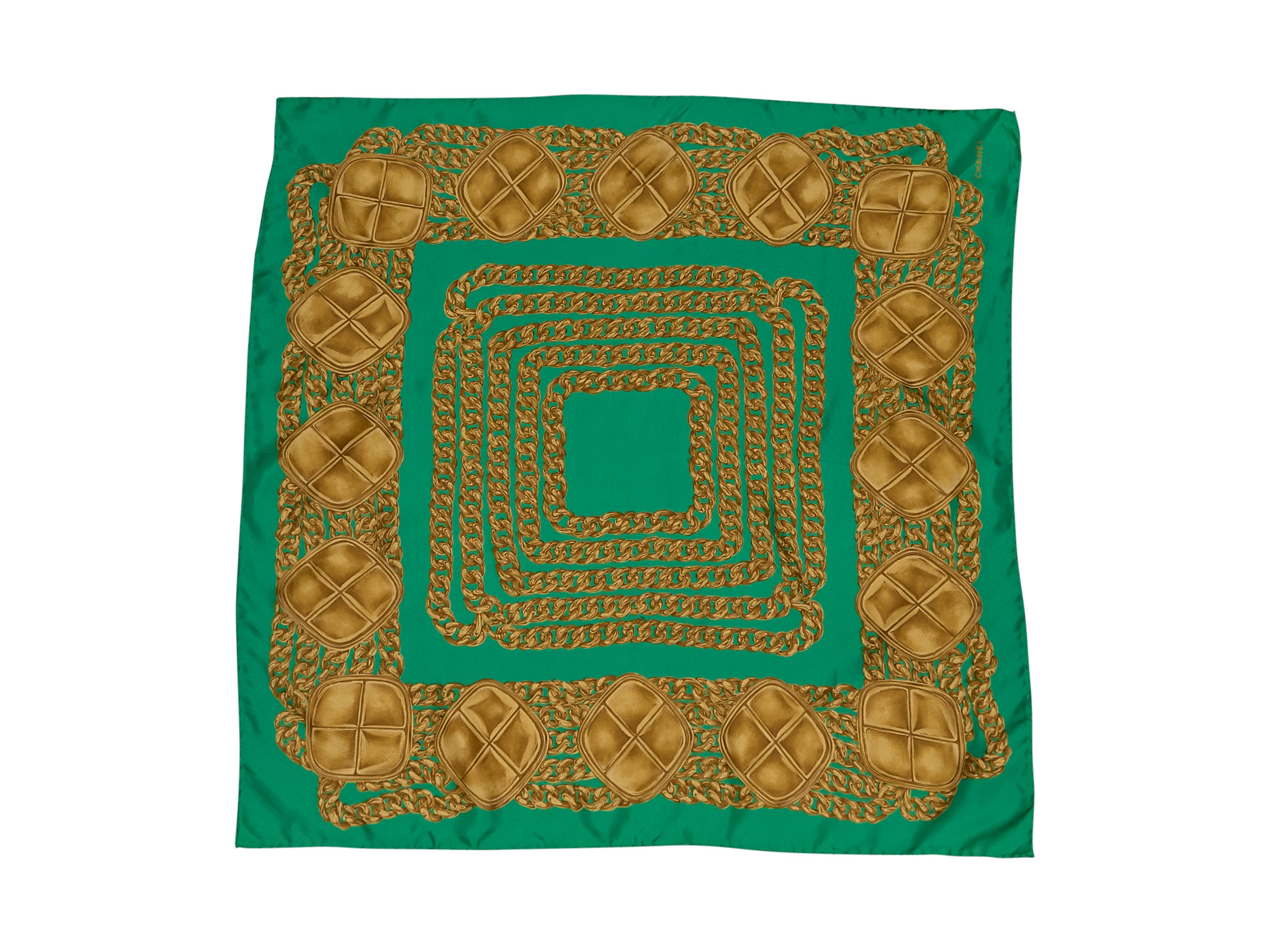 Product details:  Vintage green gold link printed silk scarf by Chanel. Wear with a cotton-poplin button-up shirt. 34