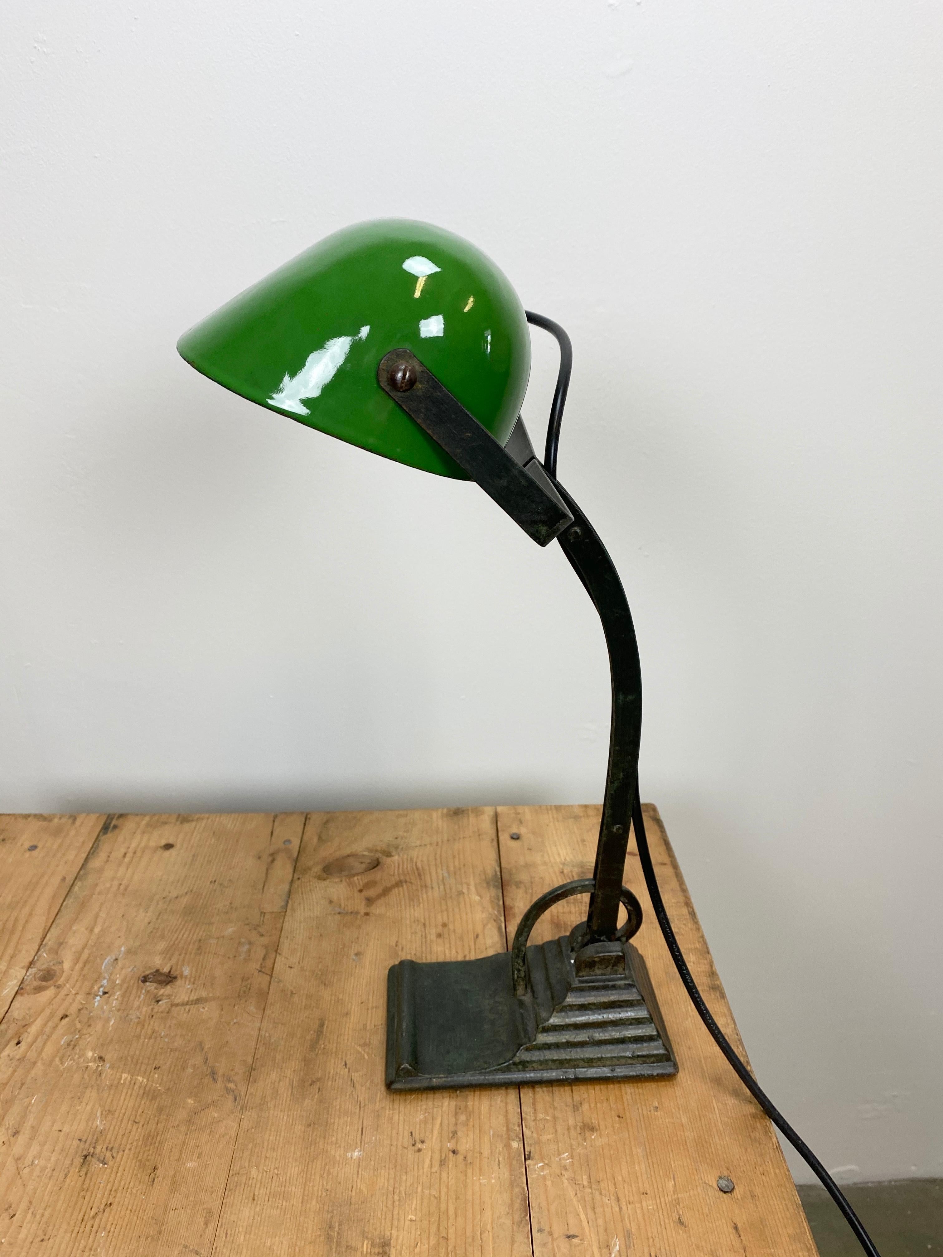 - Vintage table lamp in Bauhaus style, 1930s
- Cast Iron base
- Green enameled iron shade, white enameled interior
- The arm and shade are adjustable
- Porcelain socket for E 27 light bulbs
- New wire
- Dimensions of the shade: 22 cm x 13 cm.