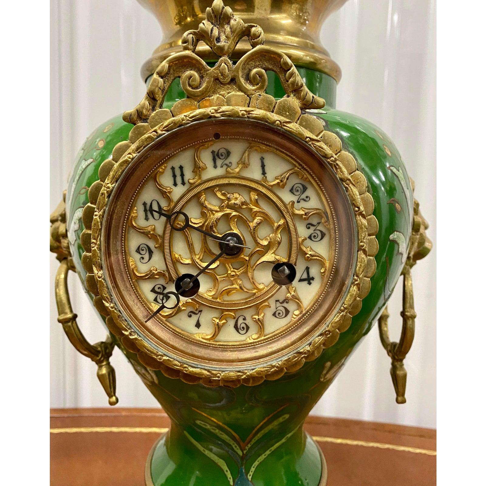 Vintage green enameled clock and candelabras, circa 1930

Gorgeous painted enamel clock with a pair of matching candelabras.

The clock measures: 7