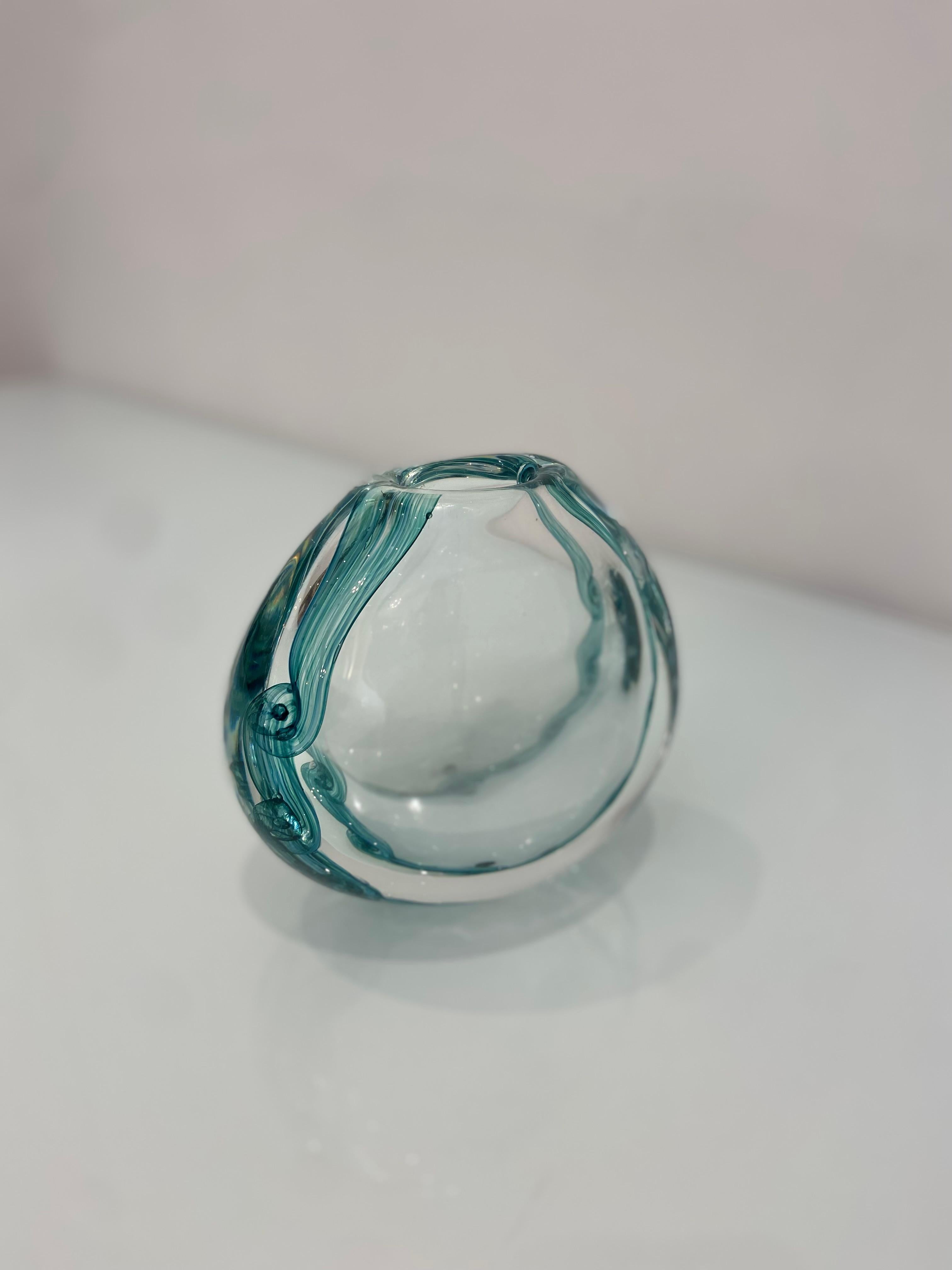 A beautiful vintage blue glass decorative vase with swirls in a deeper hue. Made by artist Ales Valner in Czech Republic, Circa 1970's.
Signed to base.