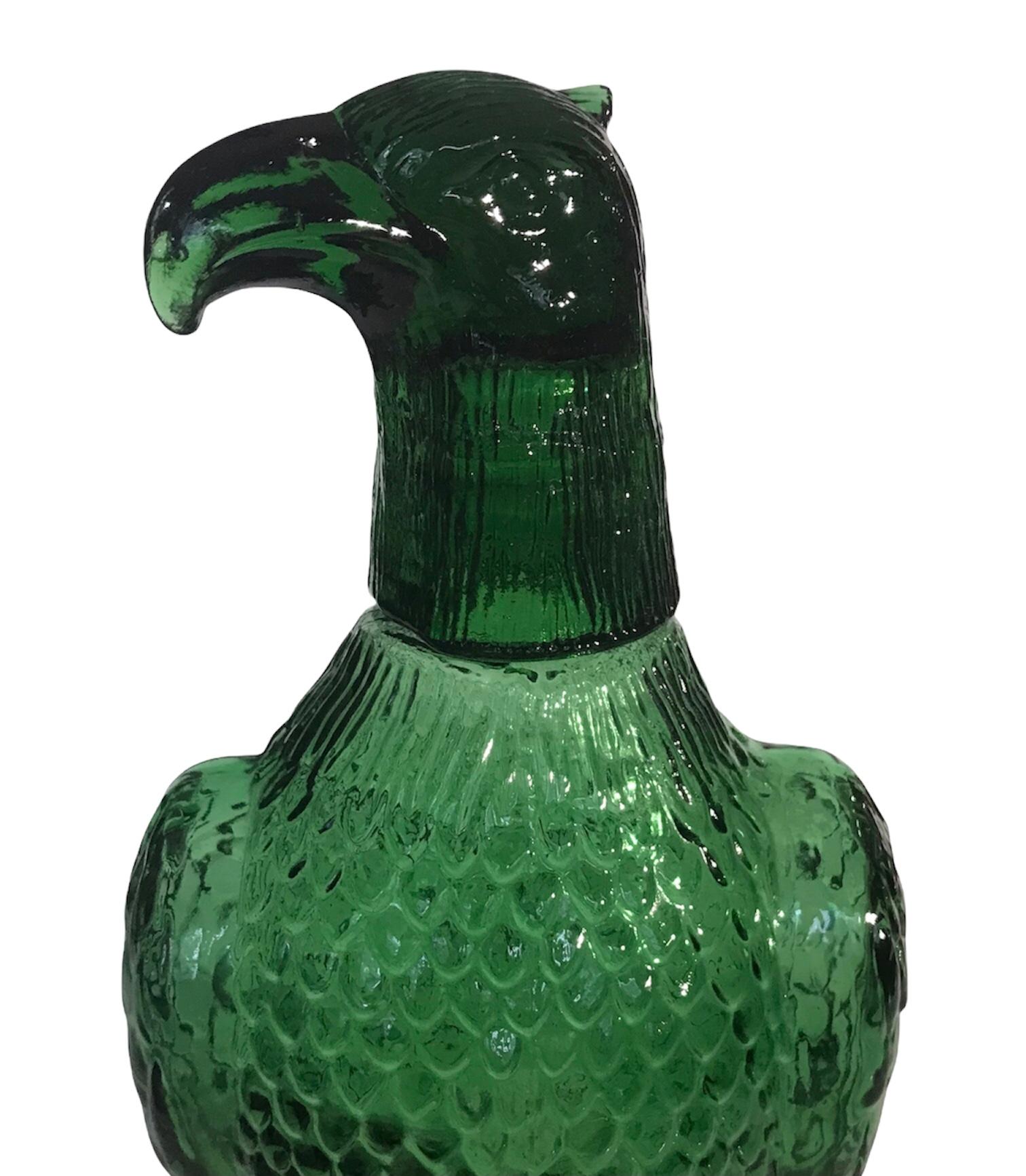 Lovely vintage blown glass Eagle decanter with shot glass head. Stunning shade of emerald green with feather detail covering the body. Eclectic, fun barware.