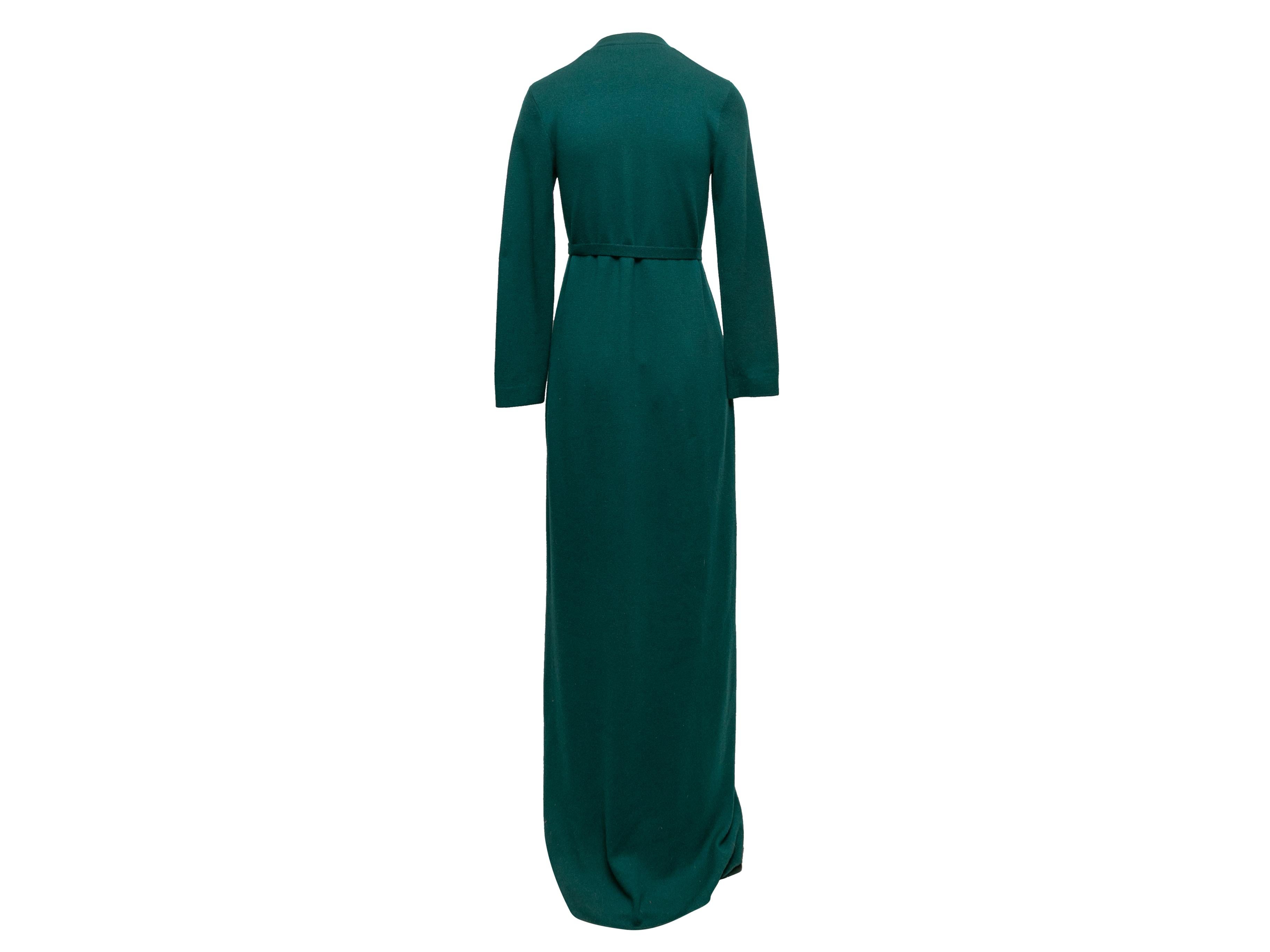 Product Details: Vintage green cashmere knit maxi dress by Halston. V-neck. Long sleeves. Dual hip pockets. Button closures at center front. 32