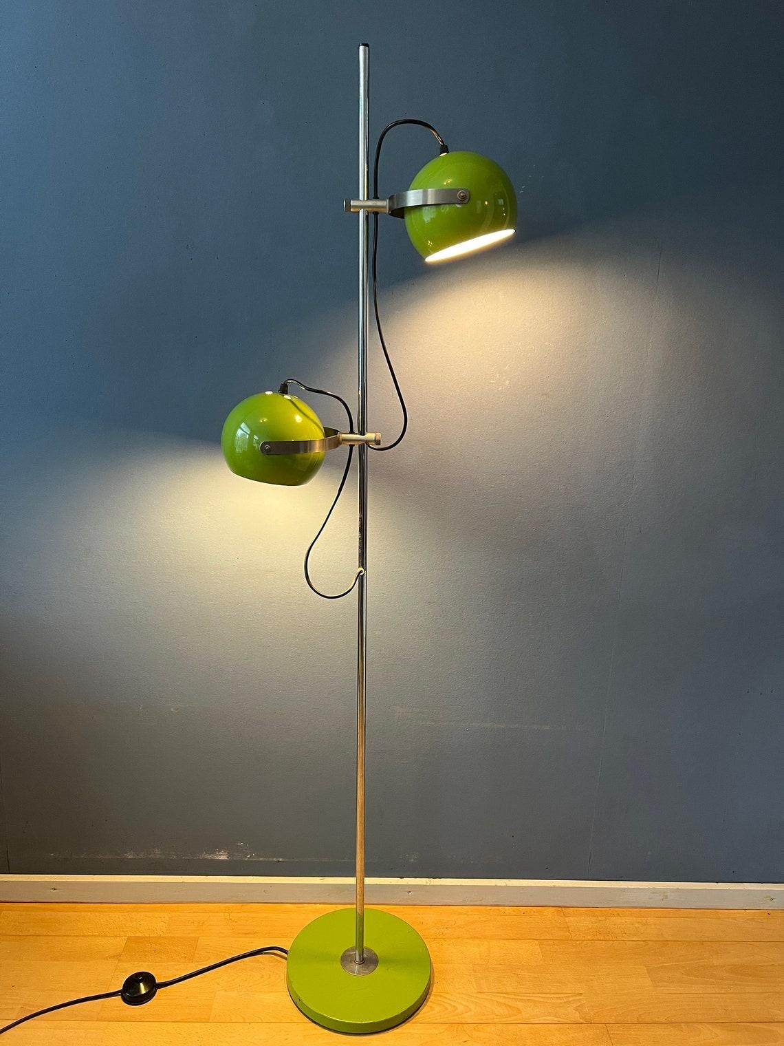 A beautiful mid century Herda eyeball floor lamp in apple green colour. The metal shades can be turned in any way desirable and moved up and down the base. The lamp requires two E27/26 lightbulbs and currently has a EU-plug (directly usable outside