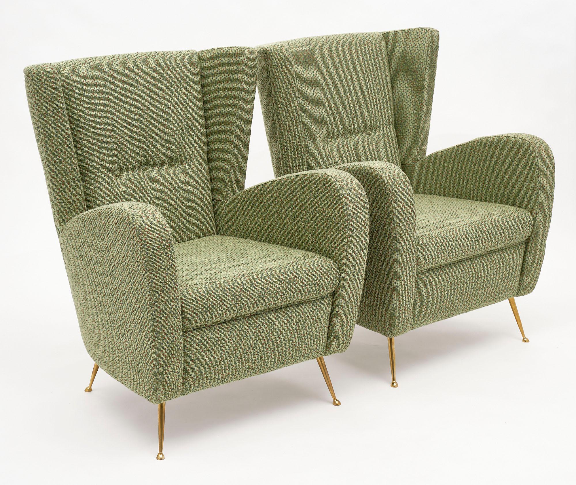 Pair of vintage green Italian armchairs by Poltrona Frau. The newly upholstered pair have a green wool blend and are supported by gilt polished brass legs. They are quite comfortable and sturdy.