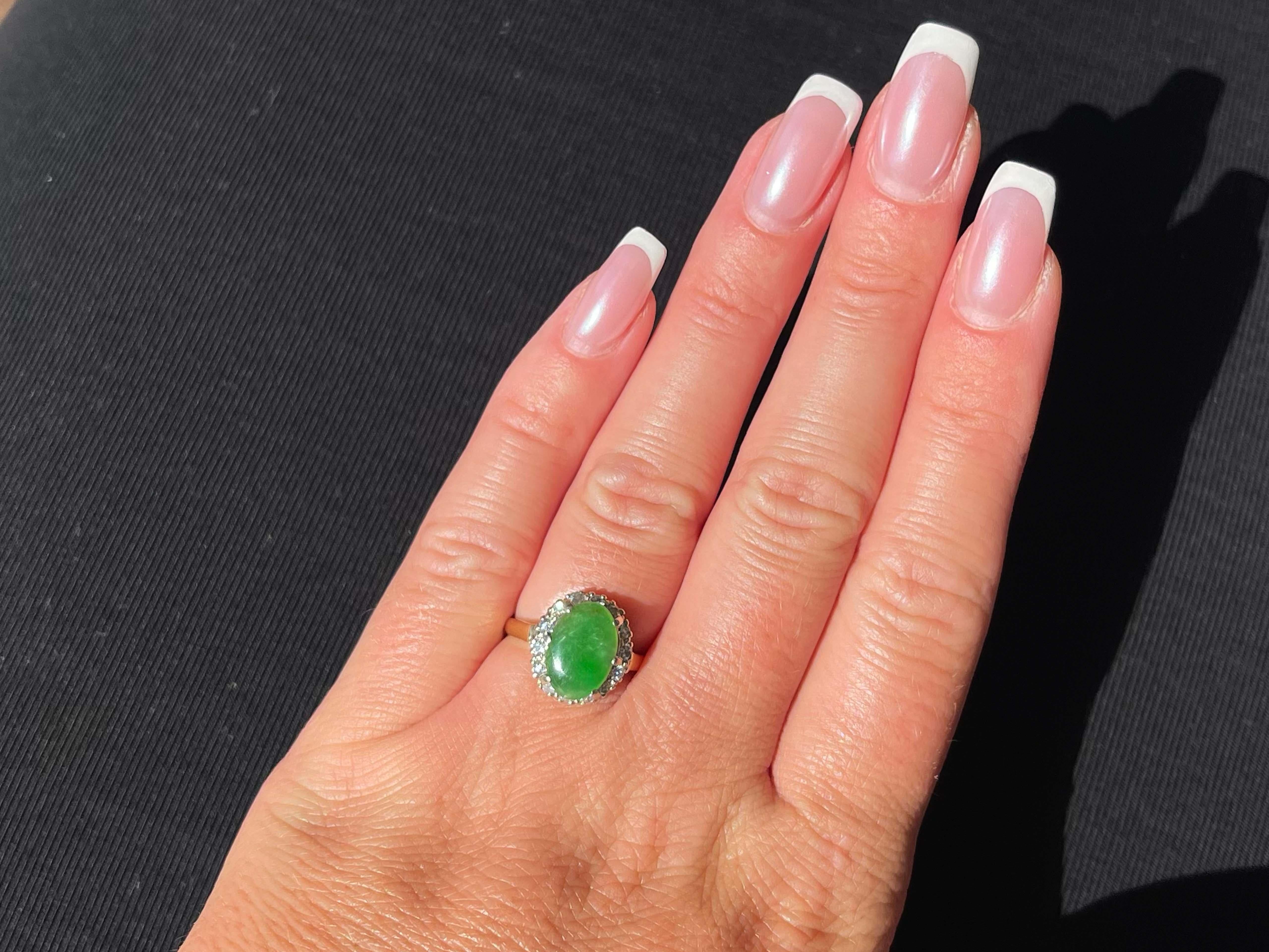 Item Specifications:

Metal: 18K Yellow Gold and 14K White Gold 

Style: Statement Ring

Ring Size: 5.5 (resizing available for a fee)

Total Weight: 3.5 Grams

Gemstone Specifications:

Center Gemstone: Jadeite Jade

Shape: Oval 

Color: