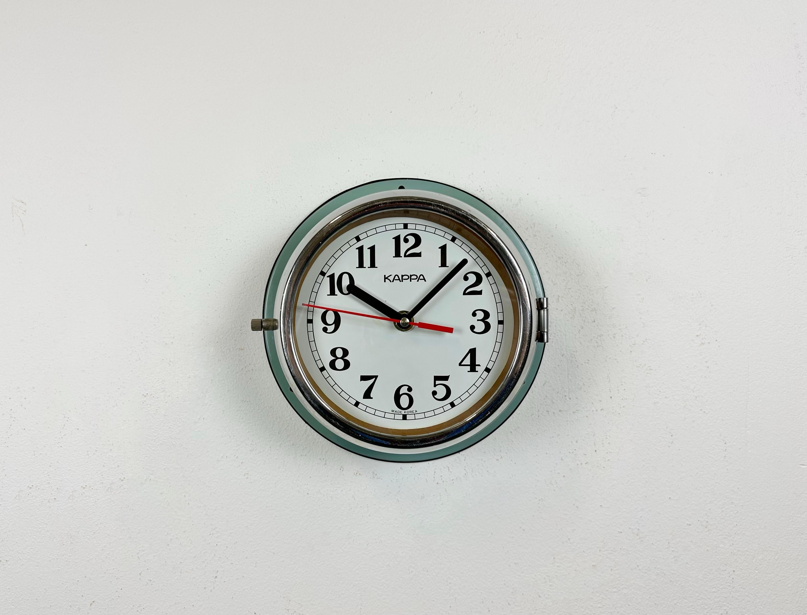Vintage Kappa navy slave clock designed during the 1970s and produced till 1990s. These clocks were used on large Korean tankers and cargo ships. It features a green metal body, a metal dial and a clear glass cover with chrome frame. This item has