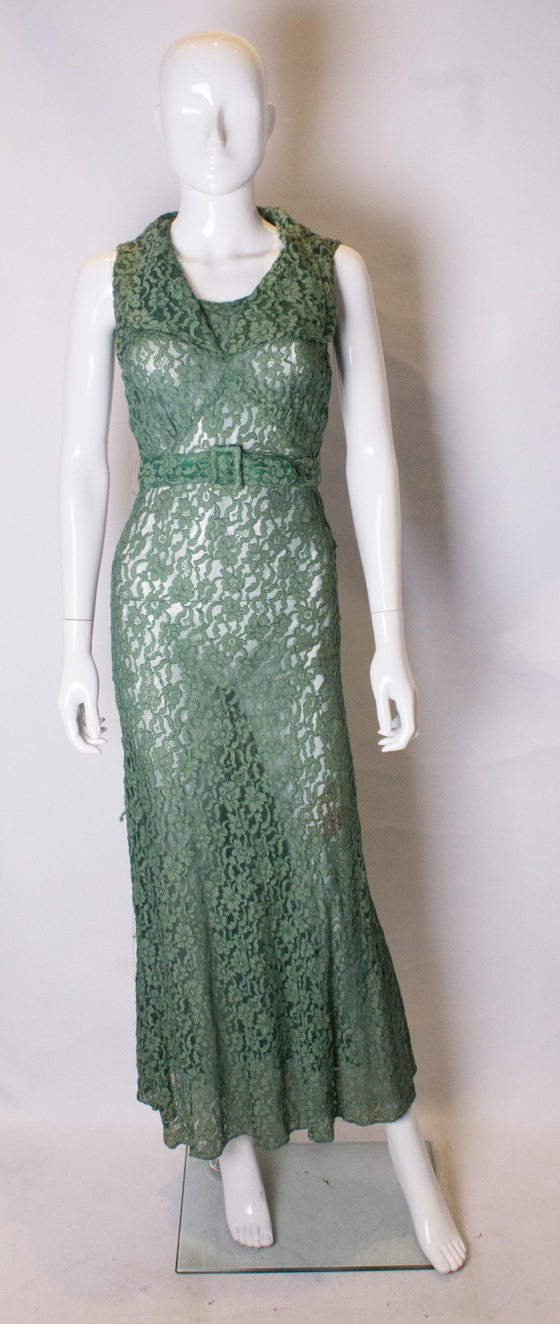 A stunning gown dating from the 1920s in green lace. The dress has a collar neckline, with side popper fastening, a matching belt and a flared skirt.
Measurements ; Bust 32'',waist 22 '', length 59''