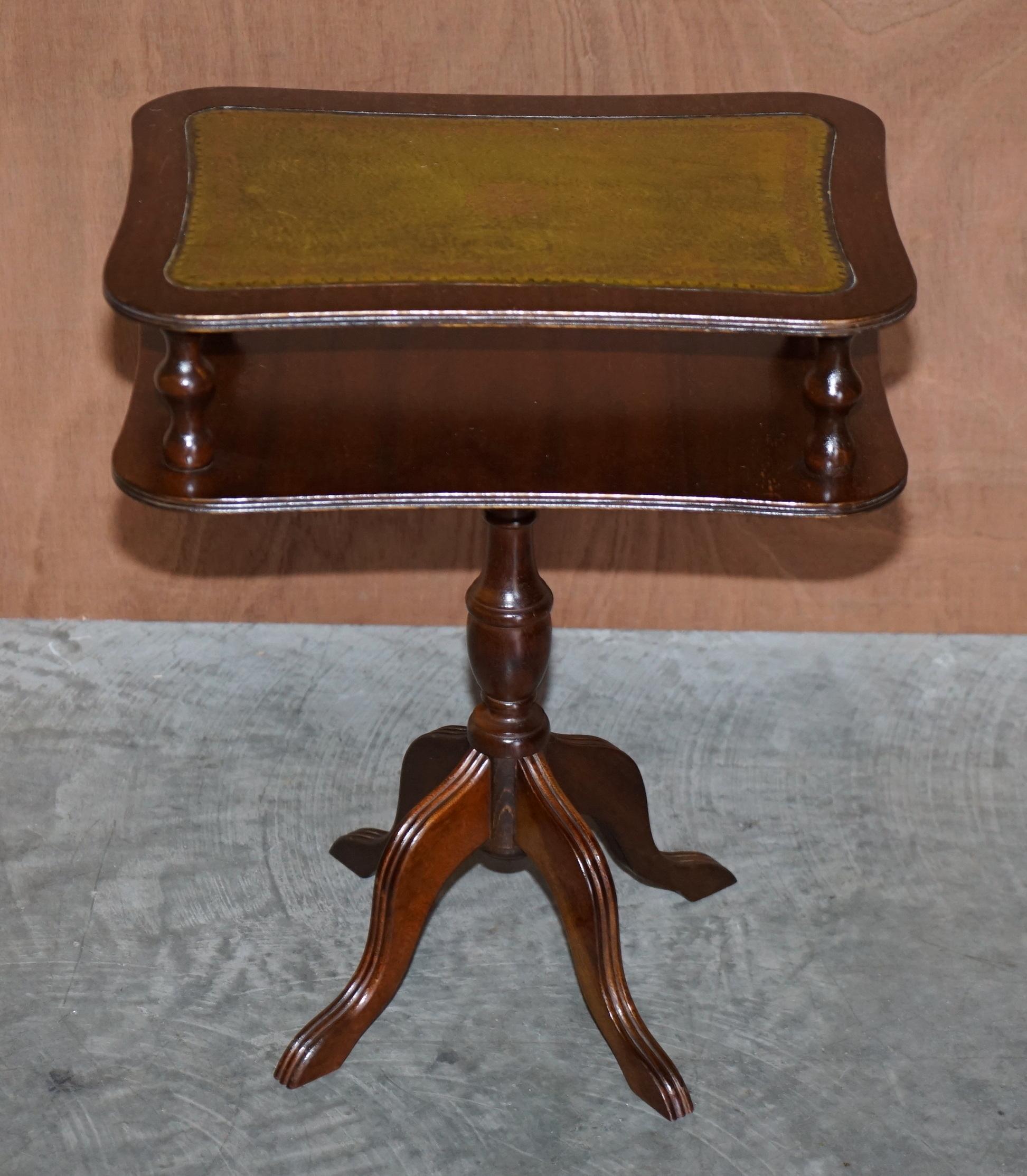 We are delighted to offer for sale this very nice vintage mahogany & green leather topped tripod table which is designed to house magazines and newspapers 

A good looking and well made piece, ideally suited for a lamp or glass of wine with a