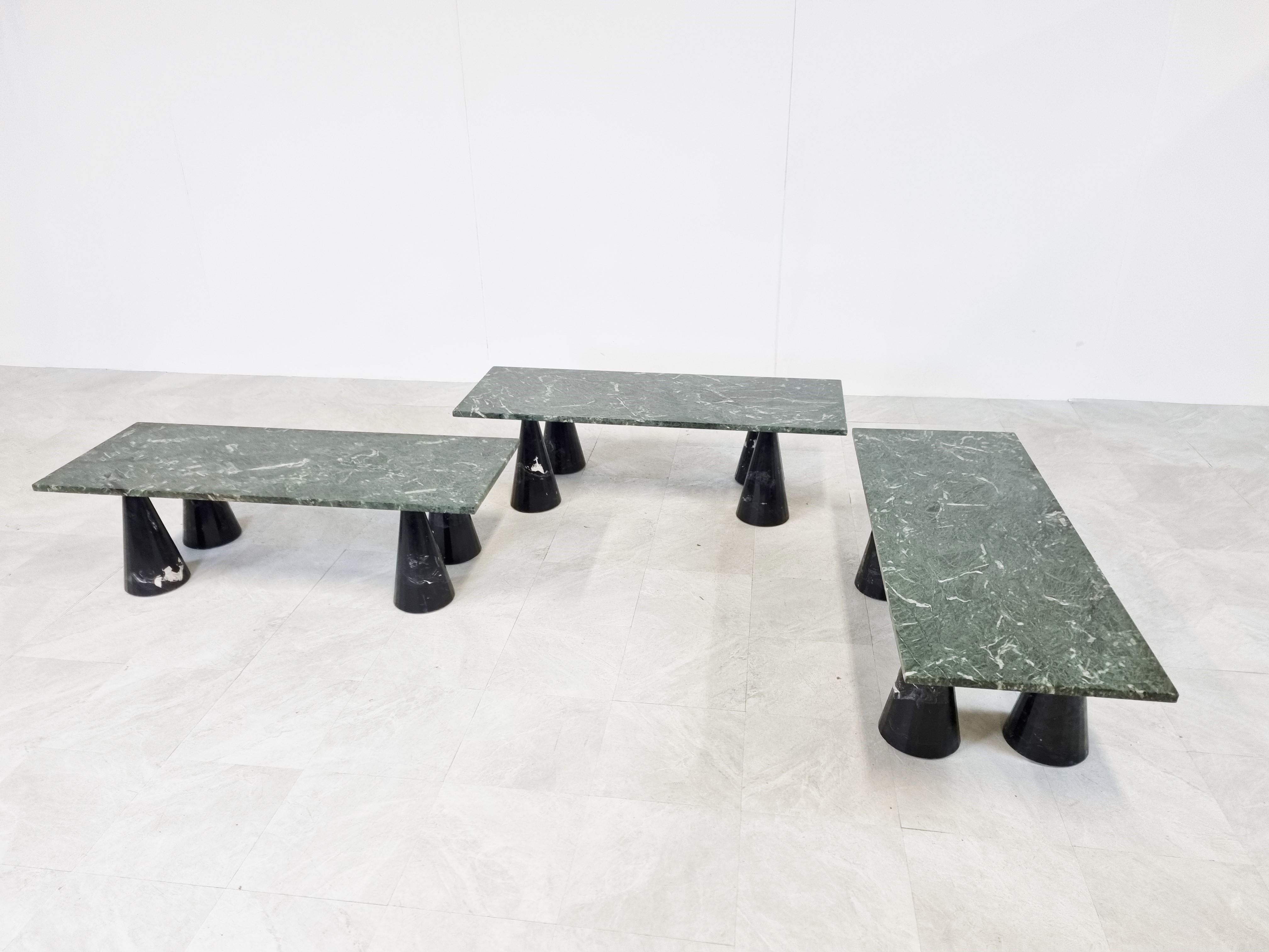 Set of playful design marble coffee tables with black marble conical legs and dark green marble table tops.

The tables can be placed in multiple setups and create a great effect togheter.

Good condition, some small chips to the bases but