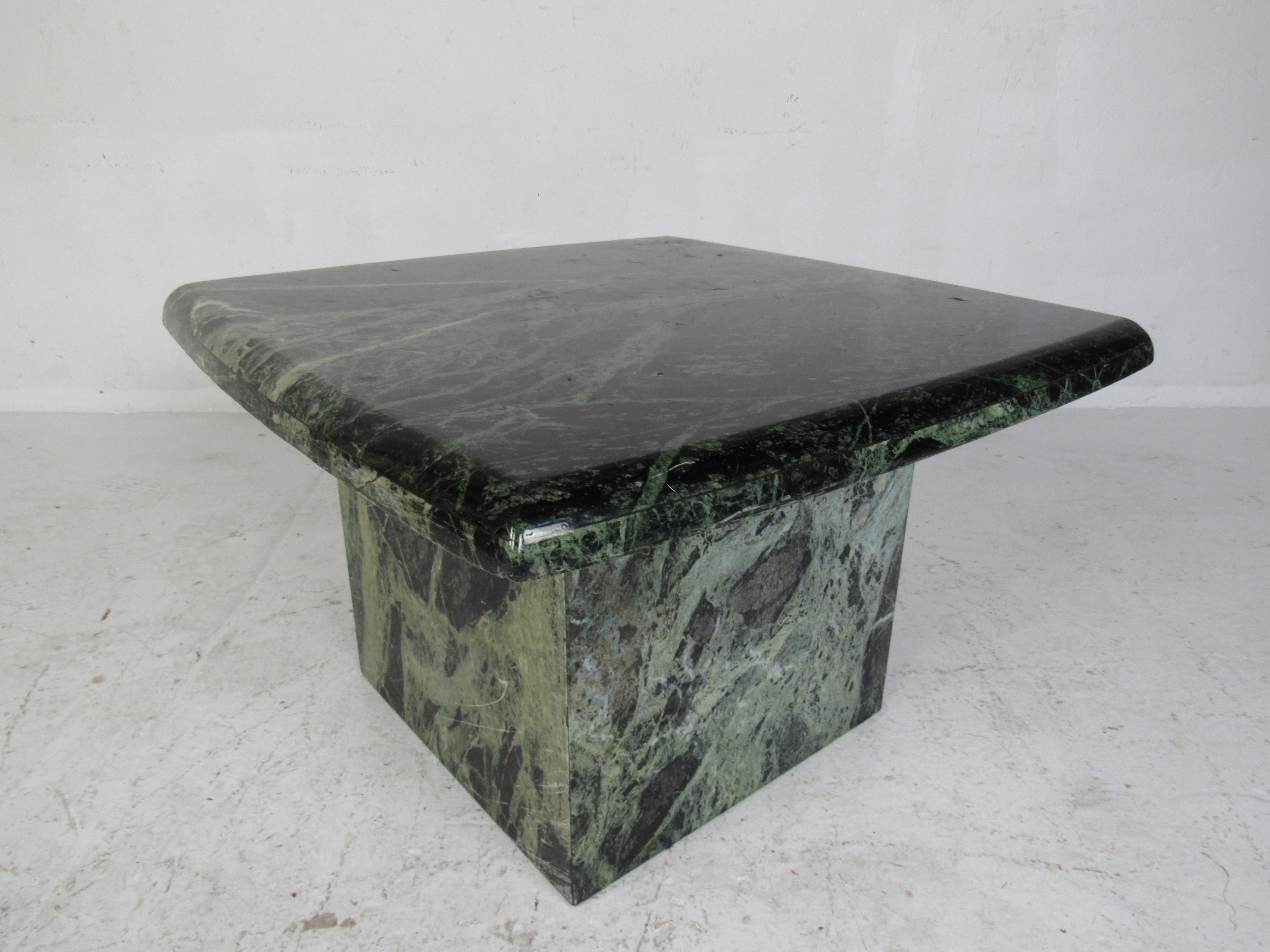 A stunning midcentury side table with a square marble top and a cube shaped pedestal base. A lovely green marble with smooth edges and unique grain. This elegant vintage end table makes the perfect addition to any home, business, or office. Please