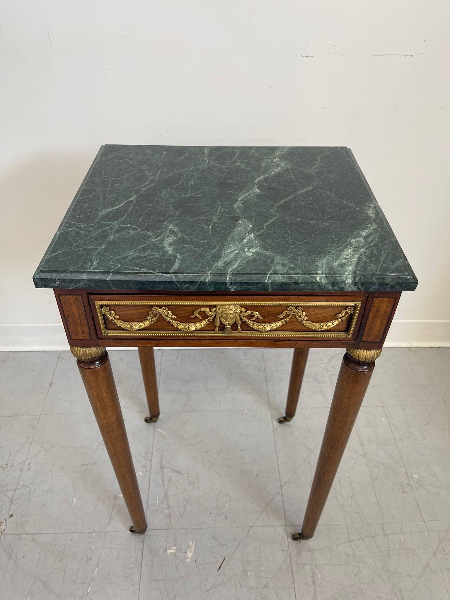 Mid-Century Modern Vintage Green Marble Top Stand on Wheels With Gold Colored Motif of Woman. For Sale