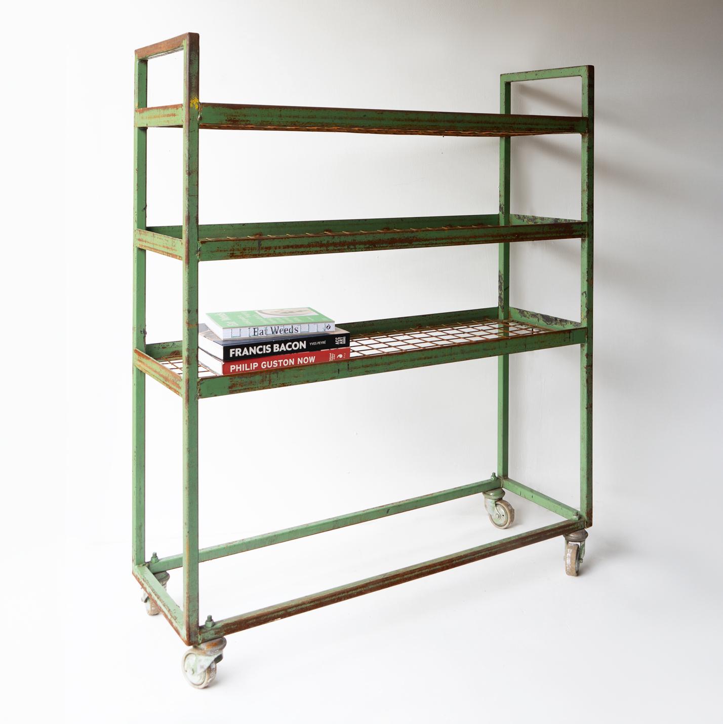MID-CENTURY SHELVING UNITS

We have two of these units available to purchase individually. The price is per unit.

Originally from an old leather shoe factory.

Of steel construction with simple lines with wirework shelves.

Remnants of old green