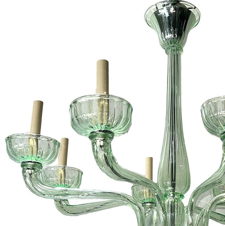 A circa 1960's Italian glass chandelier with 8 lights.

Measurements:
Diameter: 31