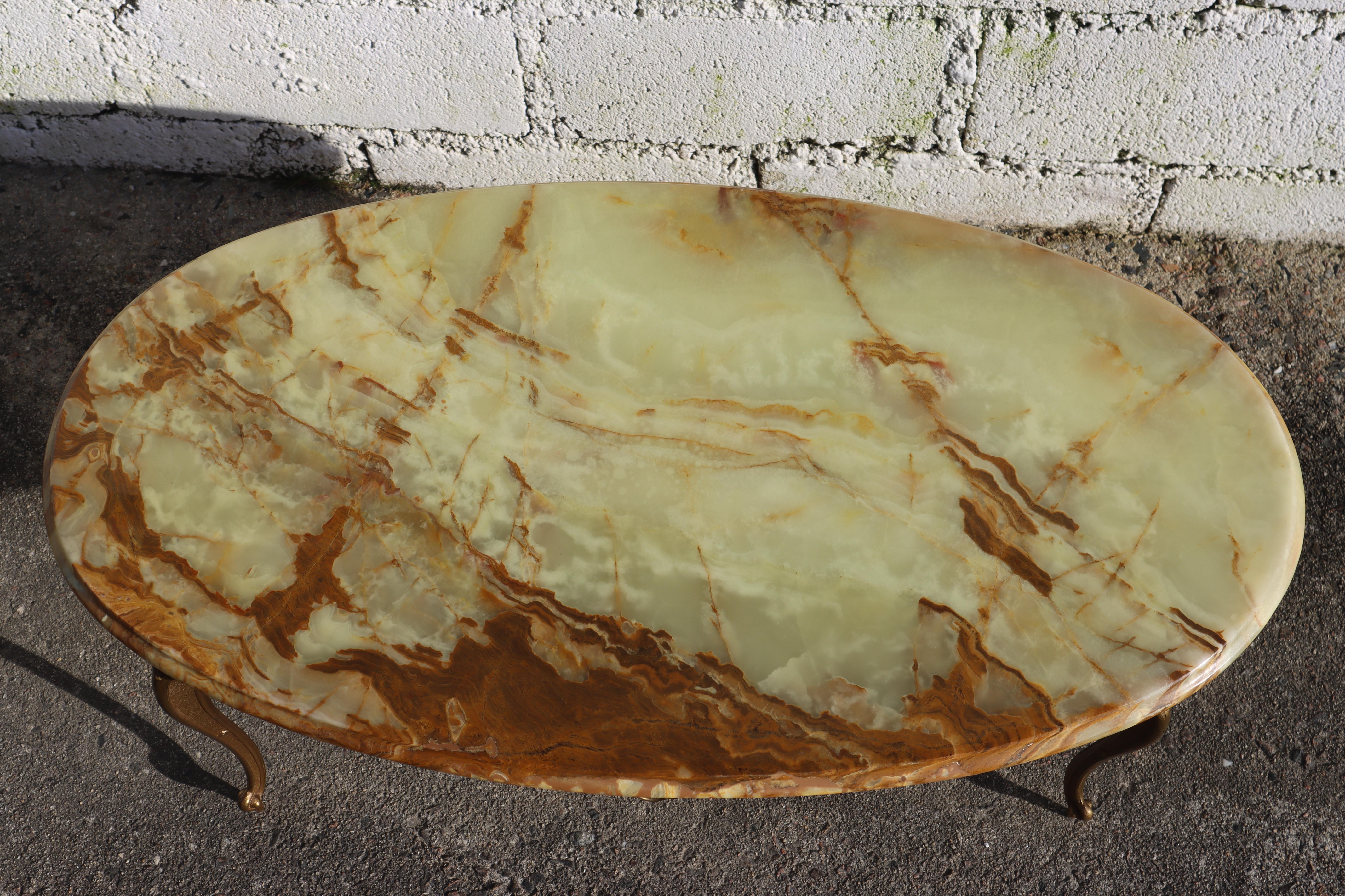 Wonderful French Vintage green Onyx Marble and Brass Coffee Table - Lounge Table Style Louis XV from the 60s
Oval Marble Top all-round decorative Edge
Splendid Colors : mother-of-pearl, mint,jade, brown,ocher orange a real colorful spectacle
Elegant