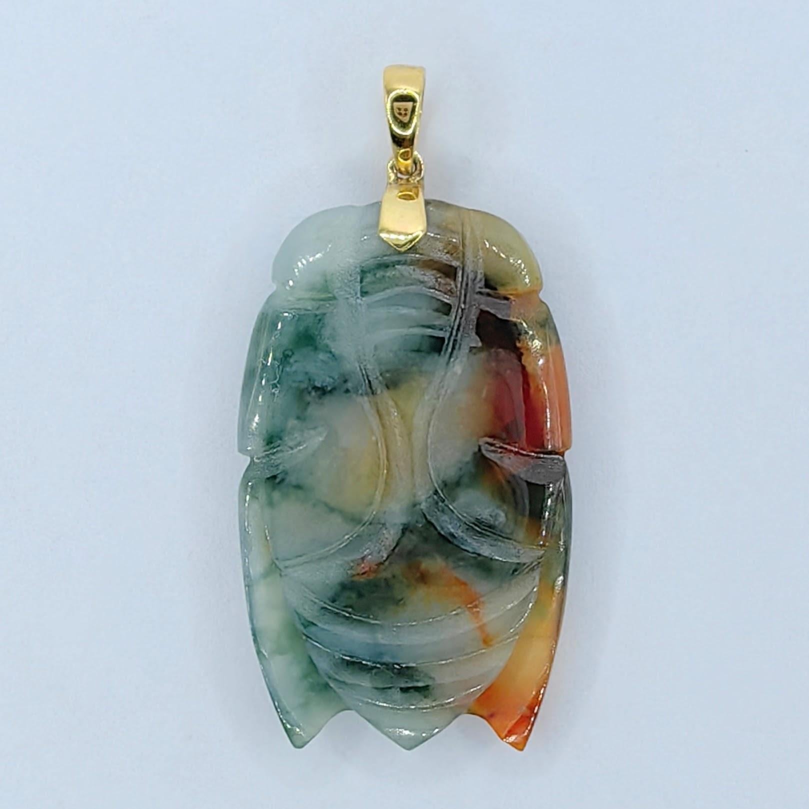 Introducing our Green Orange White Tricolor Jadeite Jade Cicada Pendant in 18K Yellow Gold, a mesmerizing piece that harmoniously combines the natural beauty of tricolor jadeite jade with the luxurious warmth of 18K yellow gold.

At the heart of