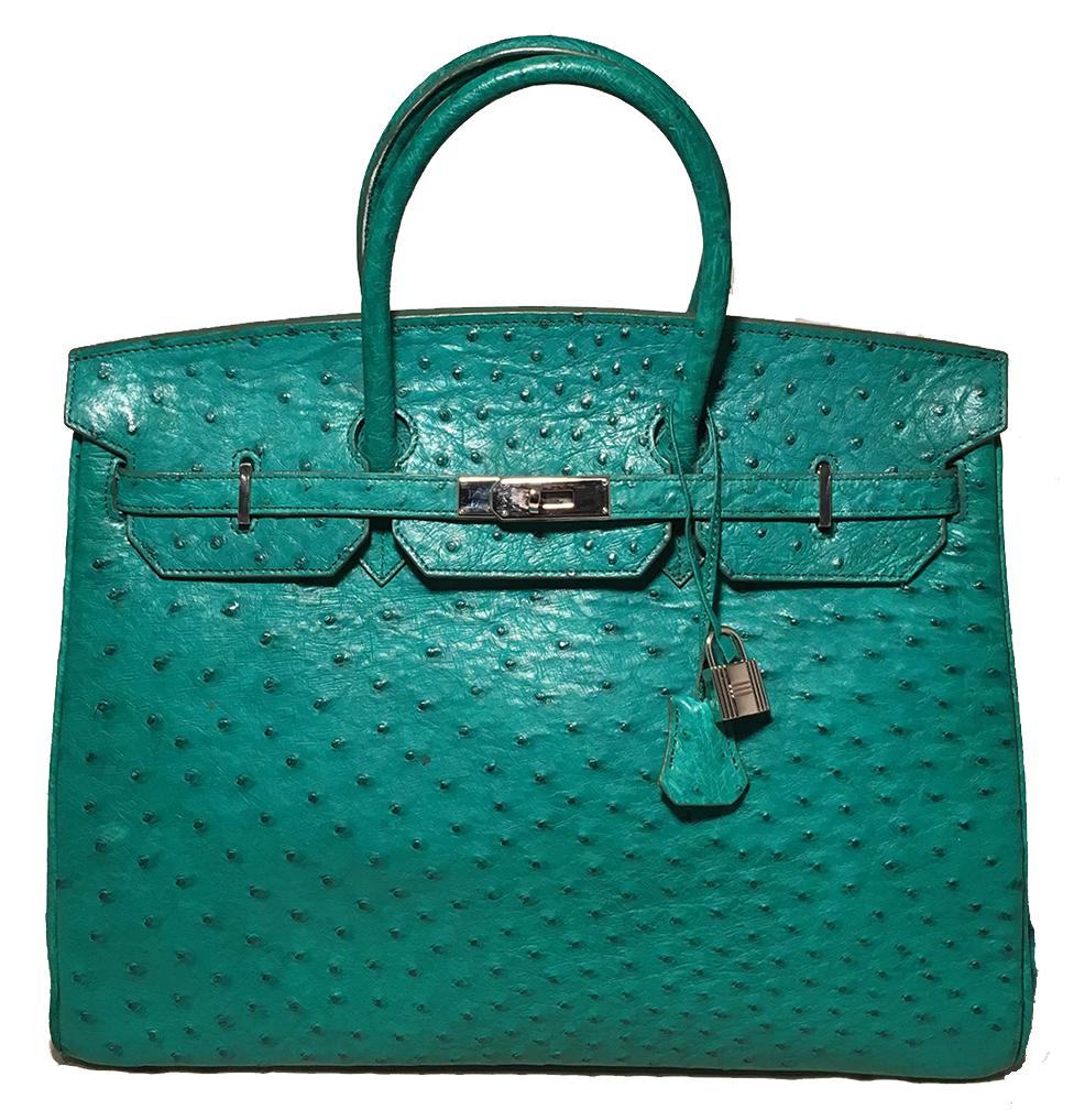 PLEASE READ FULL DESCRIPTION- this is a vintage designer piece- it is not Hermes. 

Vintage Green Ostrich Tote Bag in very good condition. Green ostrich leather exterior trimmed with silver hardware. Front turn lock double strap, notched top flap