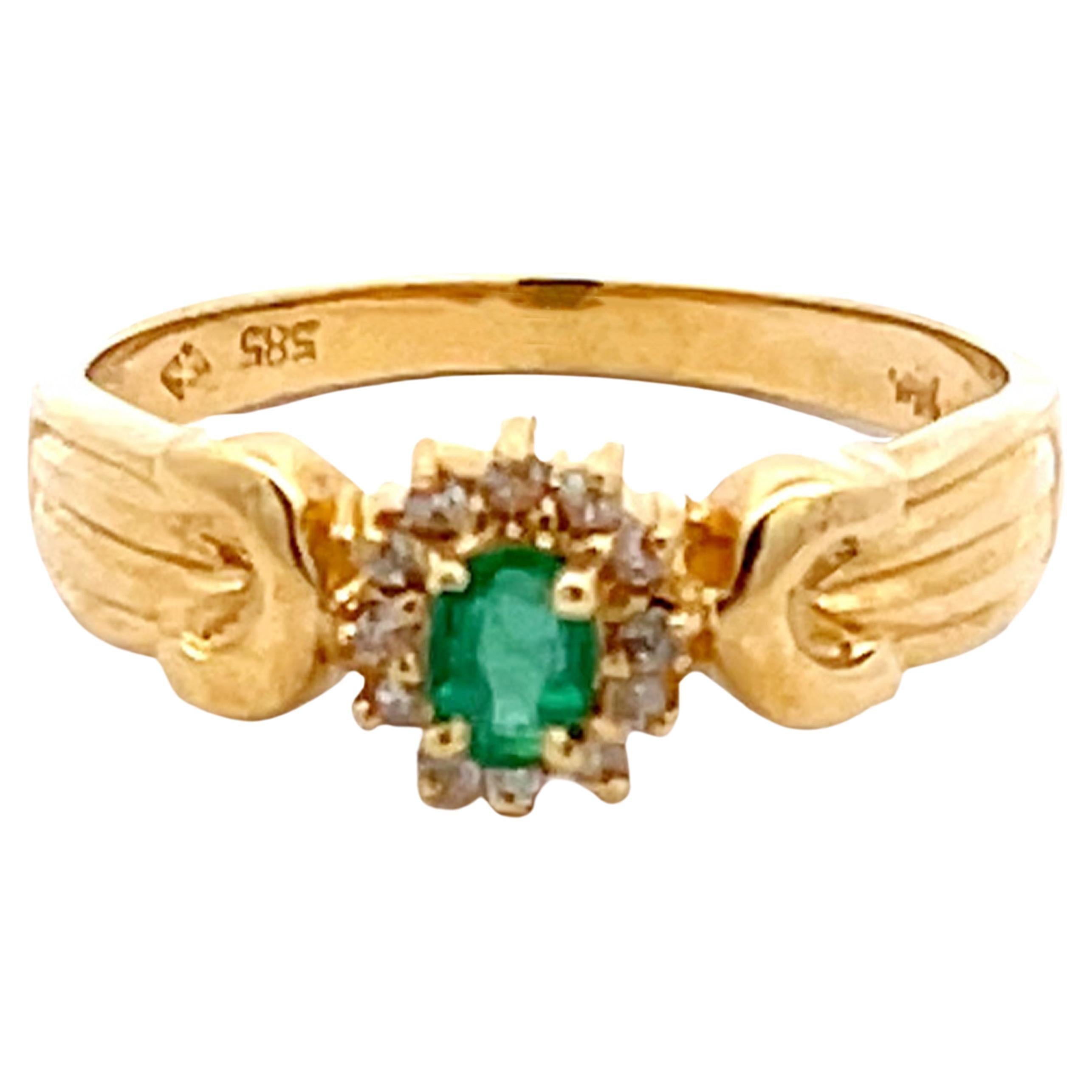 Bague vintage en or jaune 14 carats avec émeraude ovale verte et halo de diamants