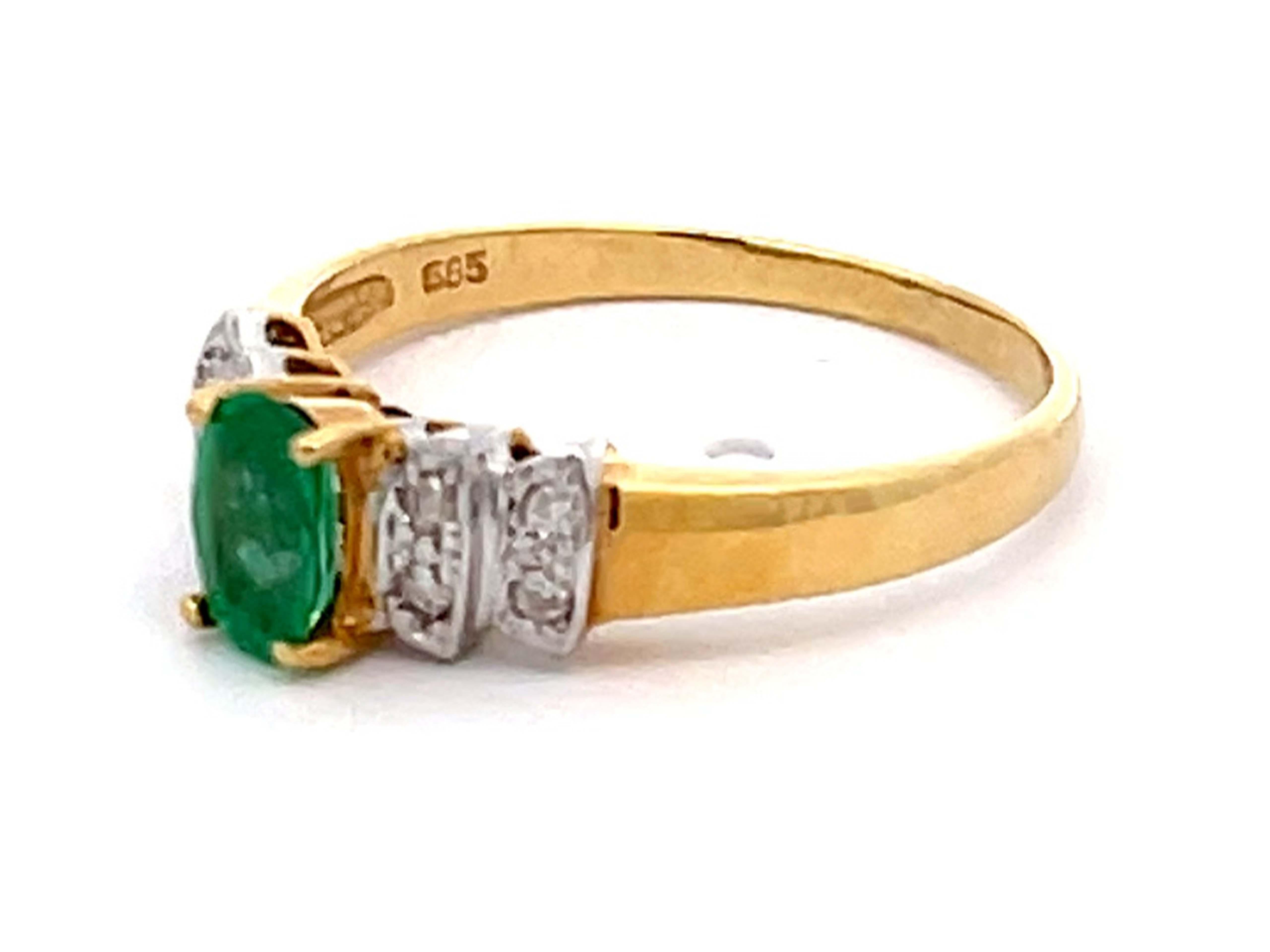 Oval Cut Vintage Green Oval Emerald and Diamond Ring in 14k Yellow Gold For Sale