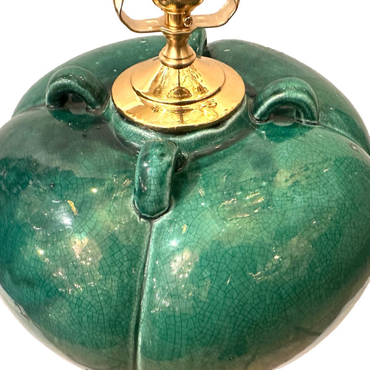 A single circa 1940's Italian green porcelain lamp with bronze base.

Measurements:
Height of body: 16