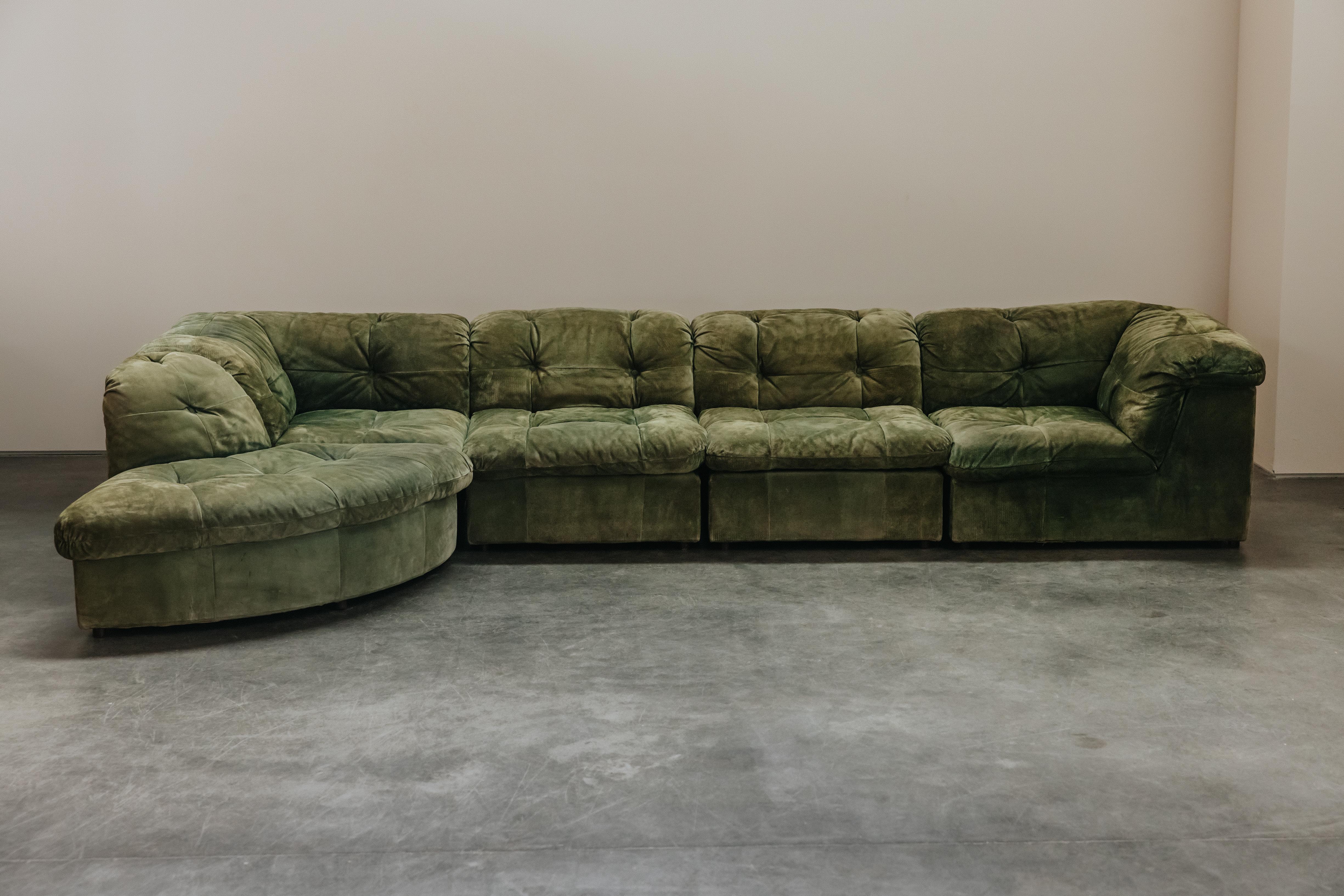 Vintage Green Suede Modular Sofa By Laauser, From Germany, Circa 1970. Nice model with nice green color. The leather on a couple buttons has worn through. Nice vintage condition.
