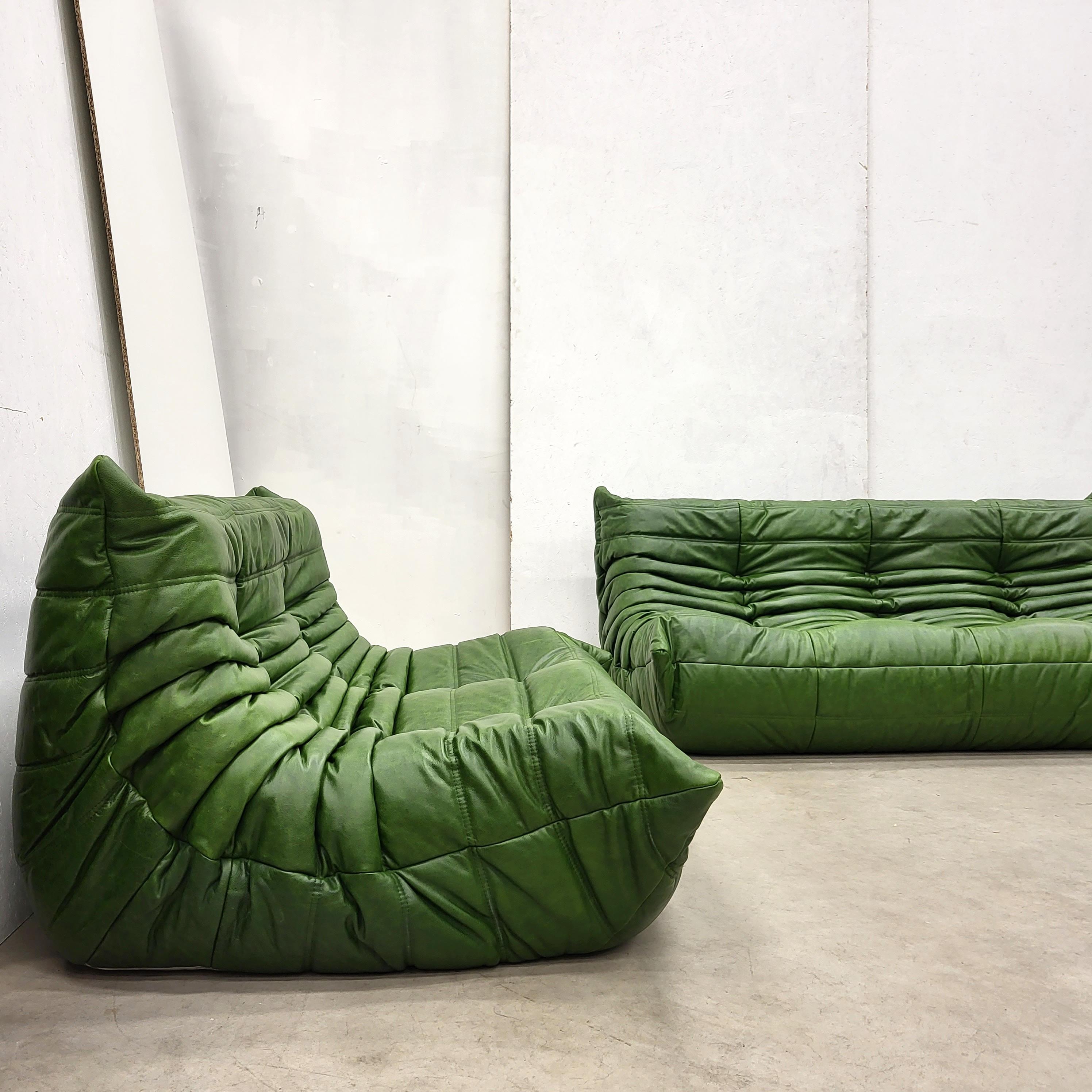 Impressive Togo seating group in Vintage green leather designed in 1973 by Michel Ducaroy for Ligne Roset in France.

The modular set includes a large sofa and 2x 2-seater sofa´s.
It can be figured into a large sofa or split into single