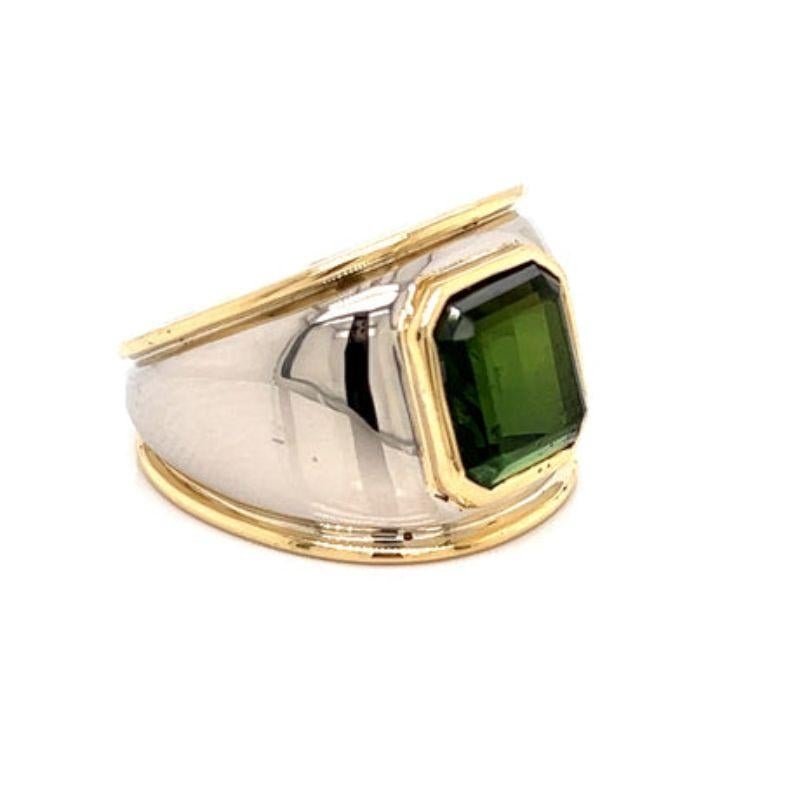 Vintage Green Tourmaline Ring

The centerpiece of this ring is a gorgeous emerald cut, 5.3 carat green tourmaline stone. The metal is 17.18 grams of 14k yellow gold and 18k white gold, giving this ring a stylish two toned look. This elegant ring is