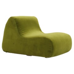 Used green velvet armchair