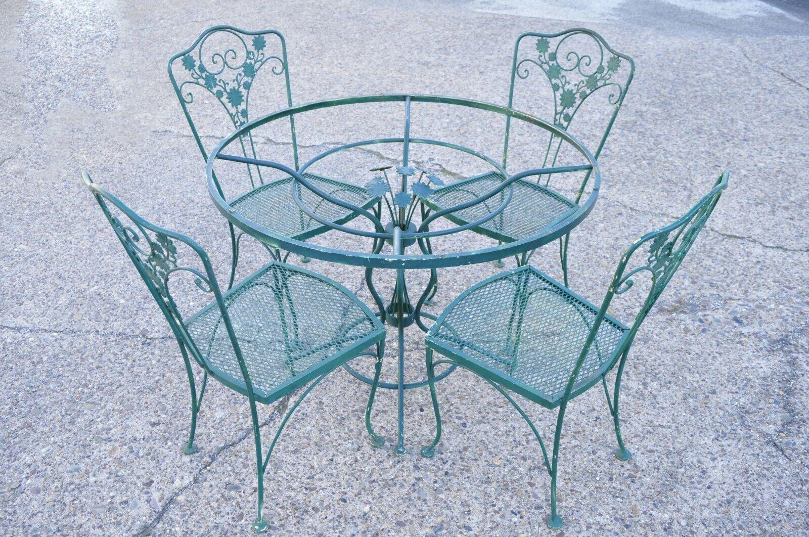 Vintage Green Wrought Iron Meadowcraft Dogwood Style Garden dining set - 5 pc Set (No glass top). Item features (4) dining chairs, (1) round dining table, flower bouquet finial to center of table, green painted finish, wrought iron construction,