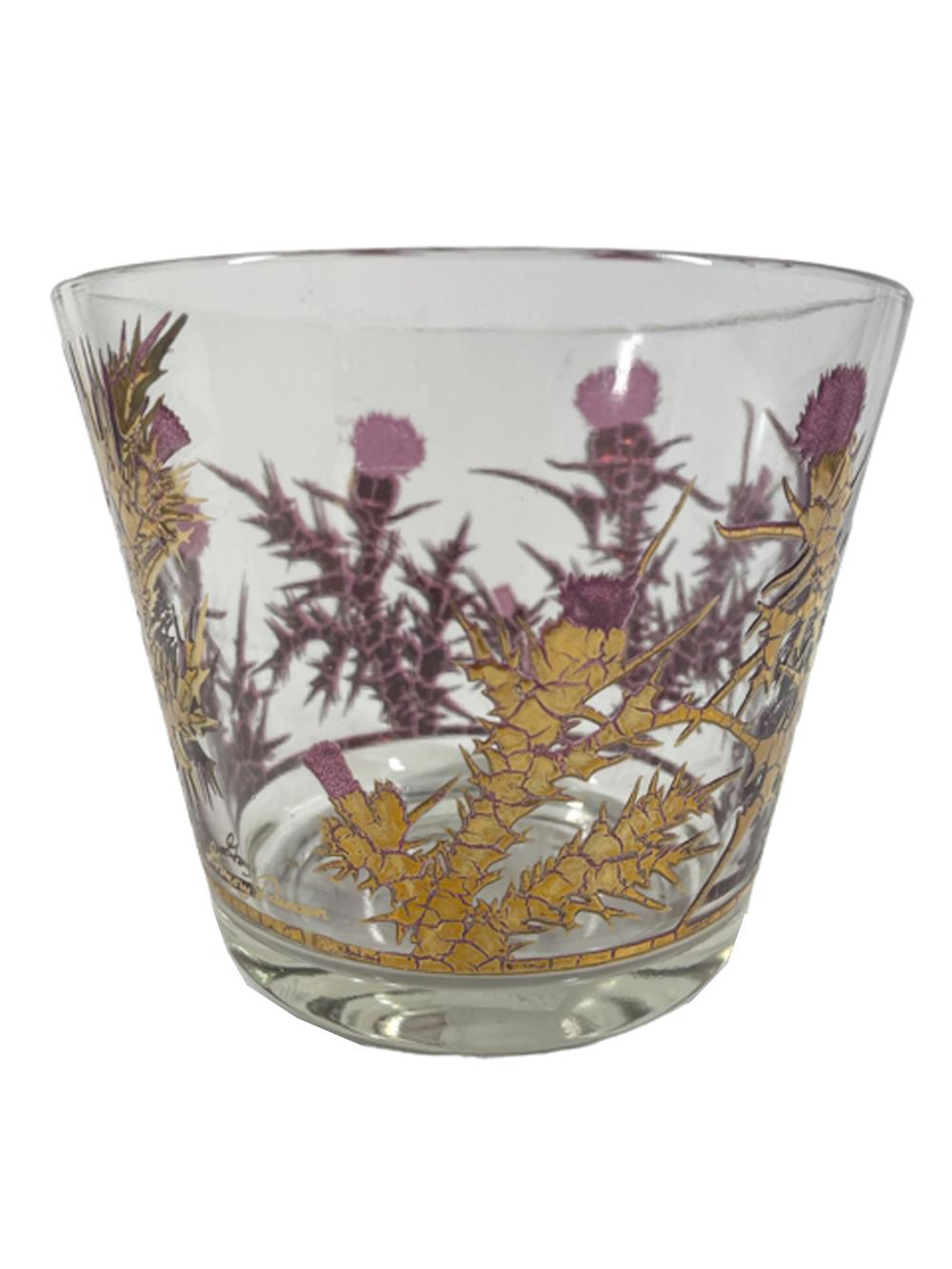 Mid-Century Modern ice bowl and four rocks designed by Gregory Duncan. Raised translucent purple enamel thistles covered in heavy 22 karat gold leaving only the purple top of the thistle bud visible on the exterior, through the interior the thistle