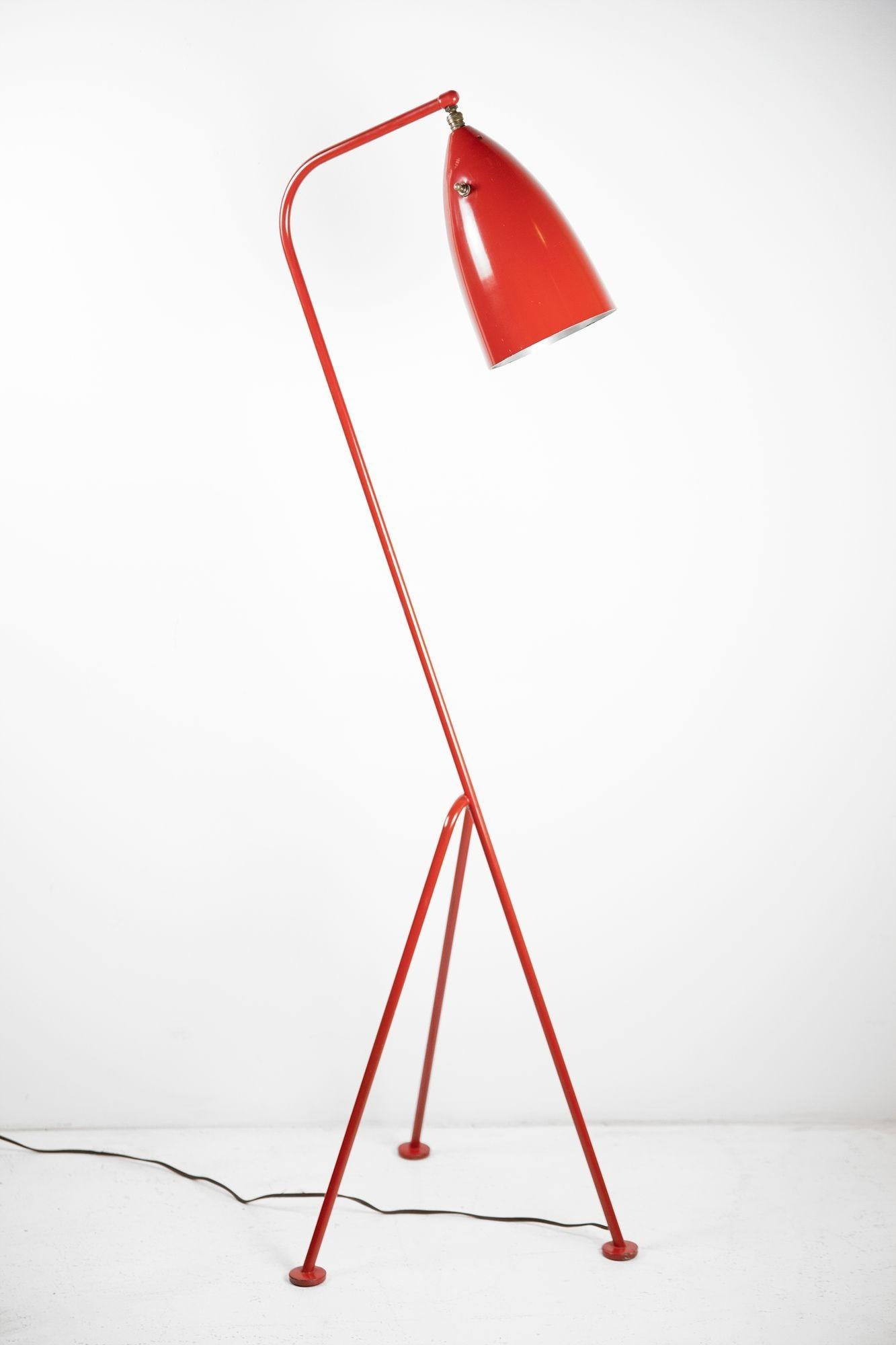 This is an extraordinarily well-preserved grasshopper floor lamp designed by Greta Magnusson Grossman and produced by Ralph O. Smith circa 1947.
 
The steel base and spun aluminum cone still retain their original bright red finish.
 
One of the