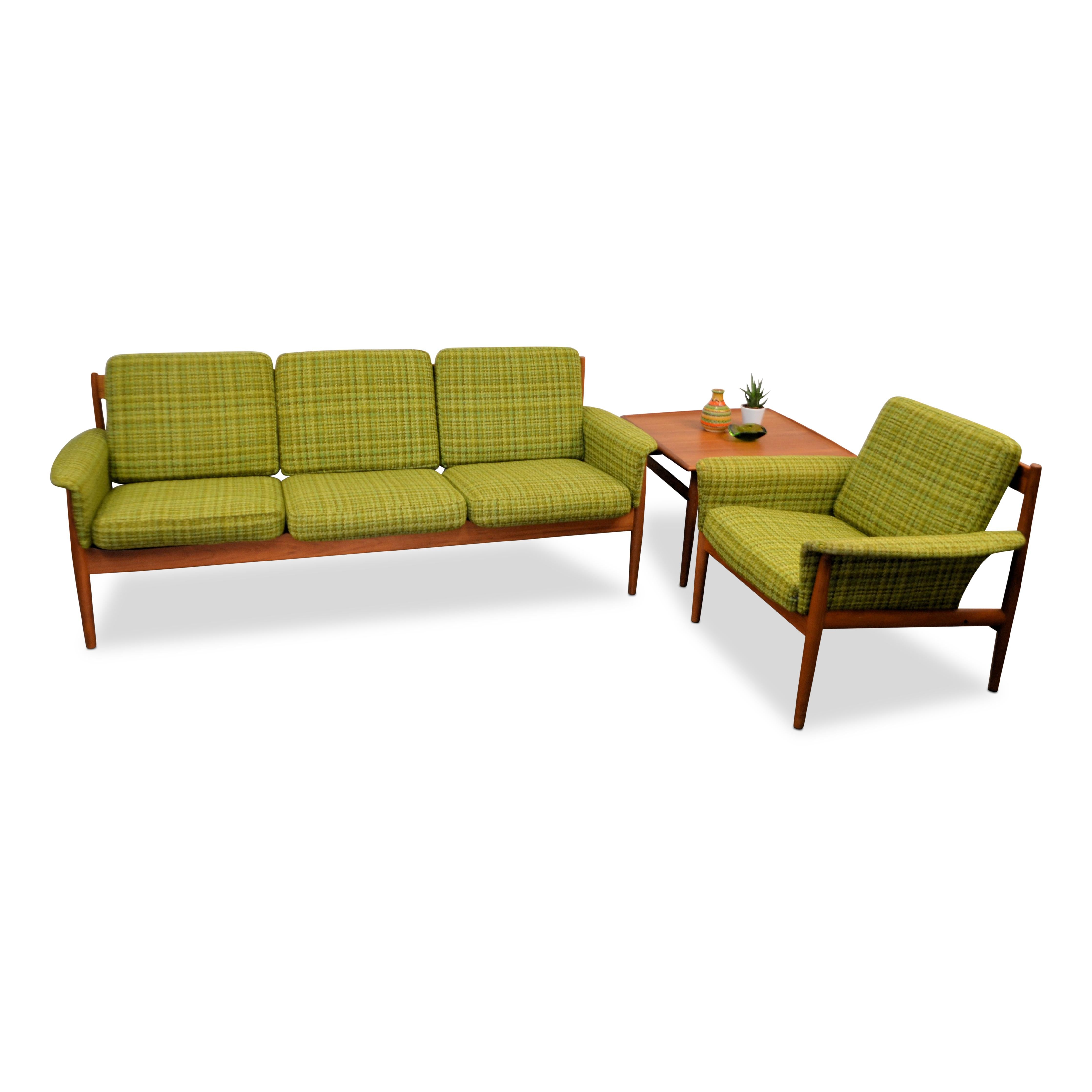 Vintage seating group consisting of a three-seat sofa, a lounge chair and side table in solid teak. Designed by Danish top designer Grete Jalk for France & Son. Grete Jalk was a driving force behind the global Expansion of Danish Design. Her simple