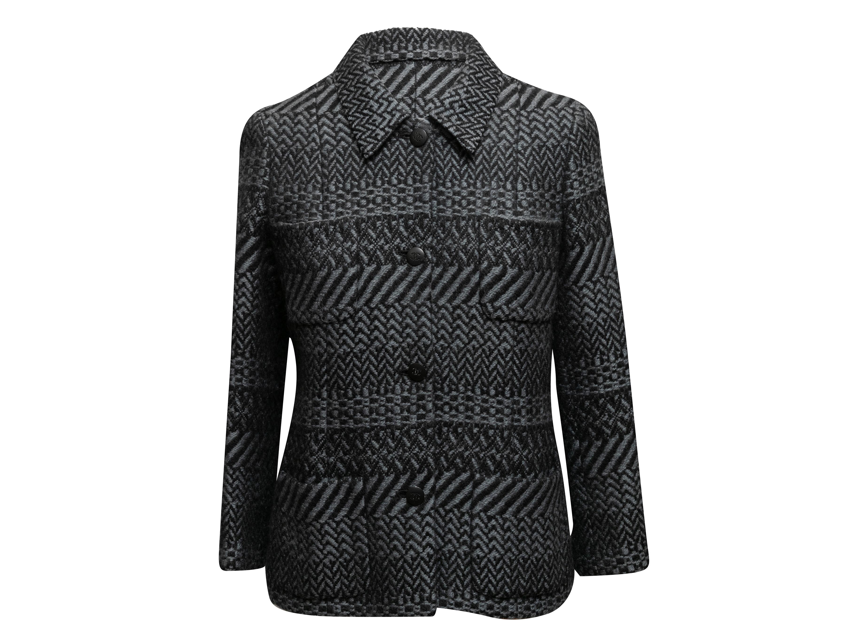 Vintage grey and black wool tweed blazer by Chanel. From the Fall/Winter 2000 Collection. Pointed collar. Four front patch pockets. Button closures at center front. 36