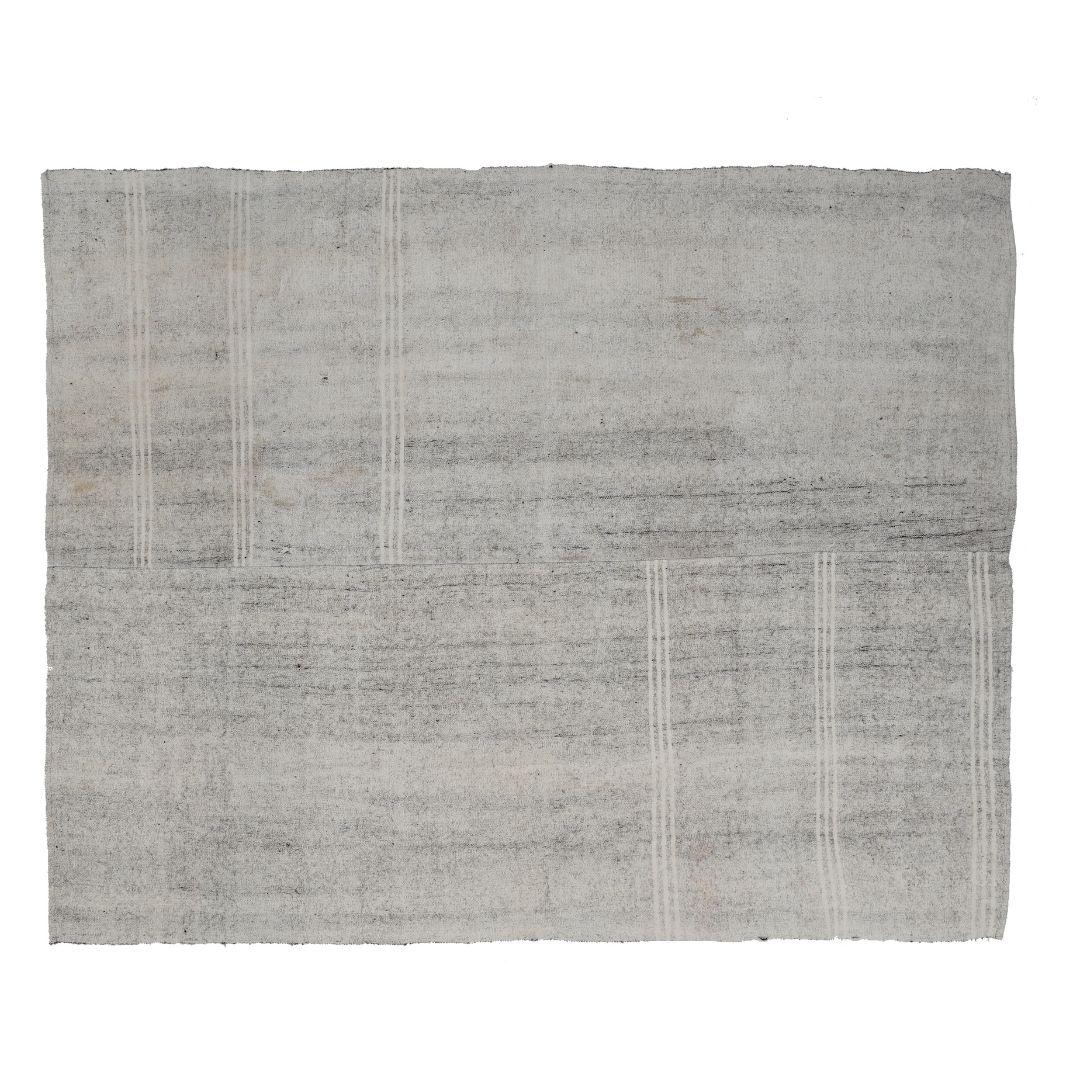 Handmade in Turkey, this vintage one-of-a-kind goat hair rug has a beautiful depth from its faded fibers that contemporary rugs simply cannot replicate. 

Our Turkish rugs are made using ancient art forms passed down through generations. Skilled