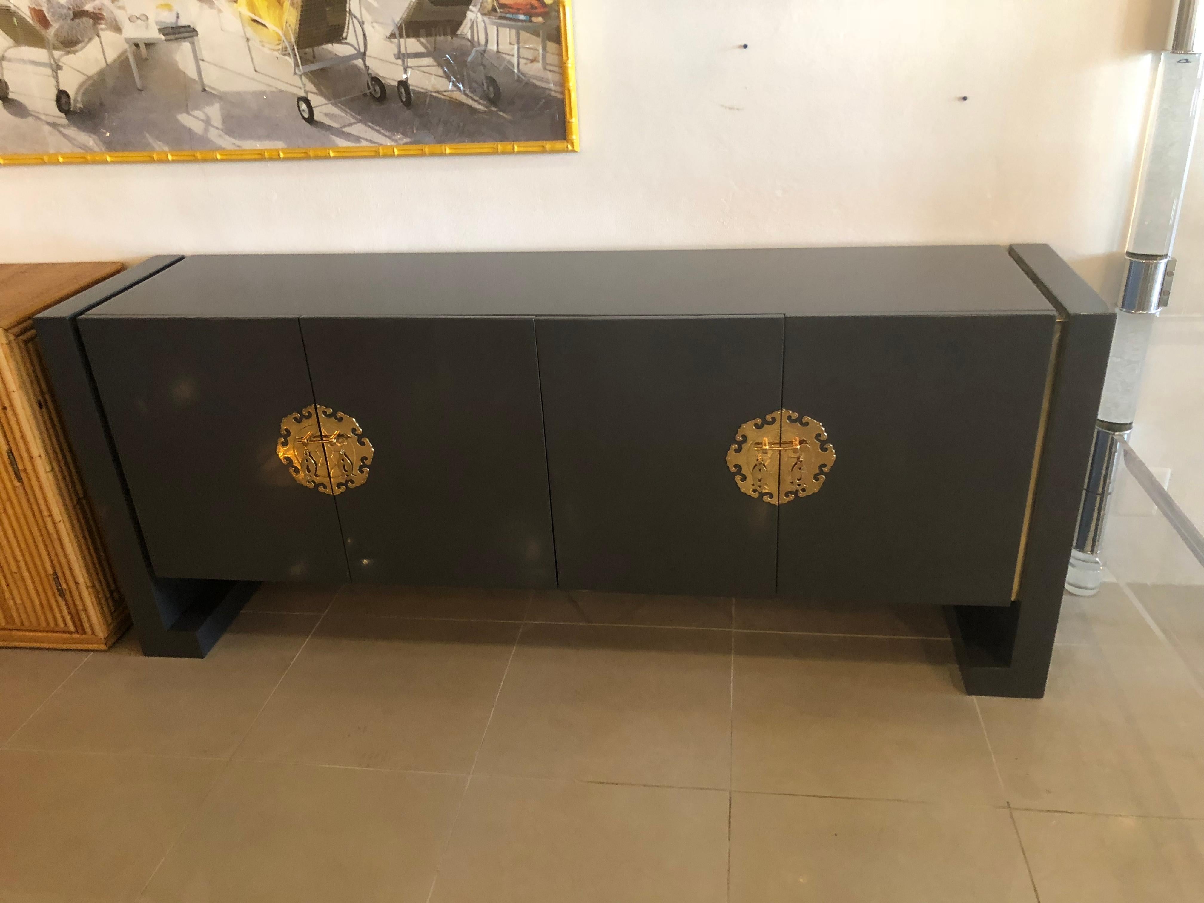 Amazing vintage newly lacquered grey and brass accent credenza, sideboard, buffet by Century Furniture. Double doors open to reveal a shelf. There may be minor imperfections to the newly lacquered vintage piece.
 