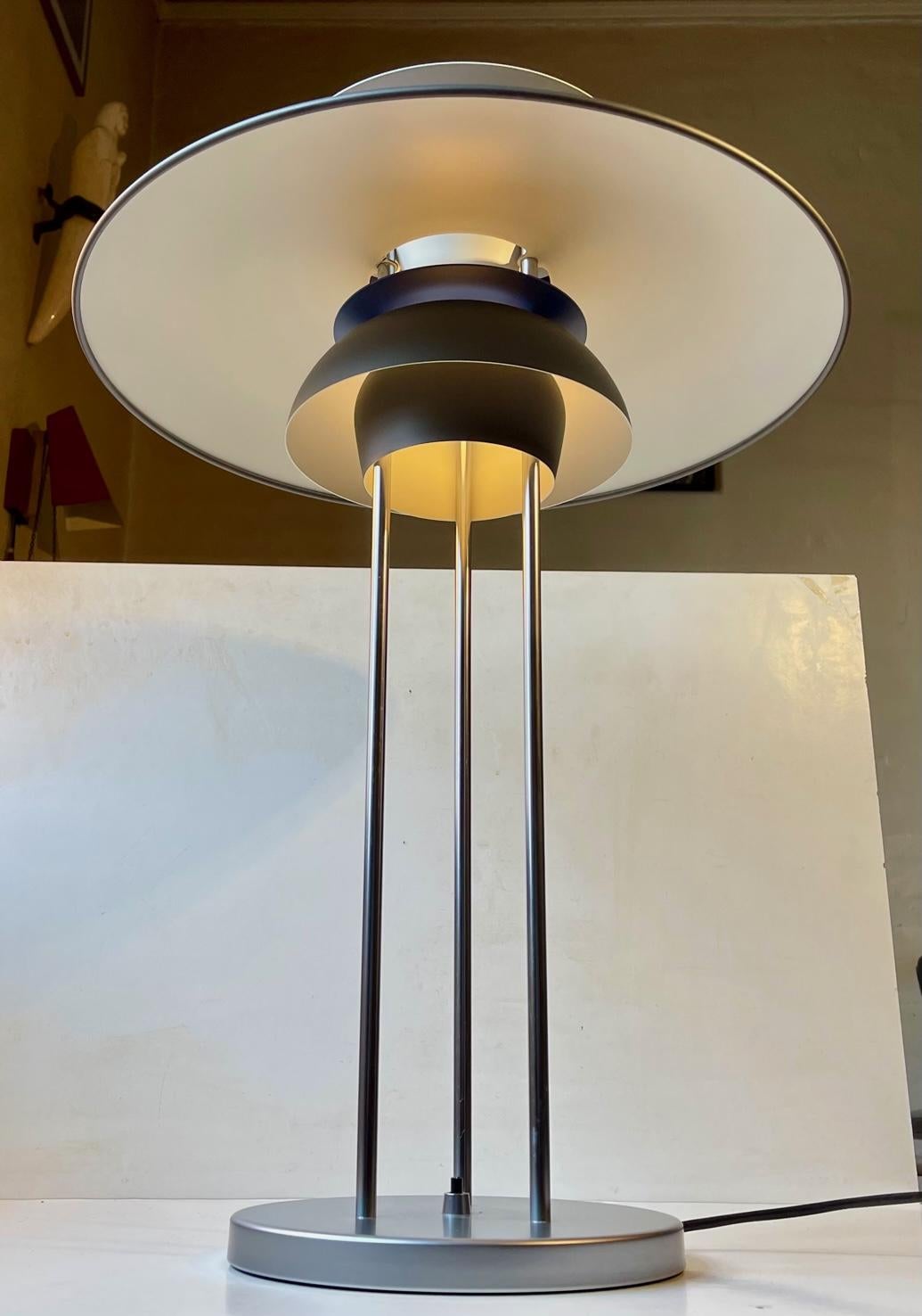 A large and pristine example of the PH5 table or desk lamp designed by Poul Henningsen in 1962. This vintage piece is an excellent representation of Henningsen's larger PH series, all based on the idea of using multiple shades and diffusers to
