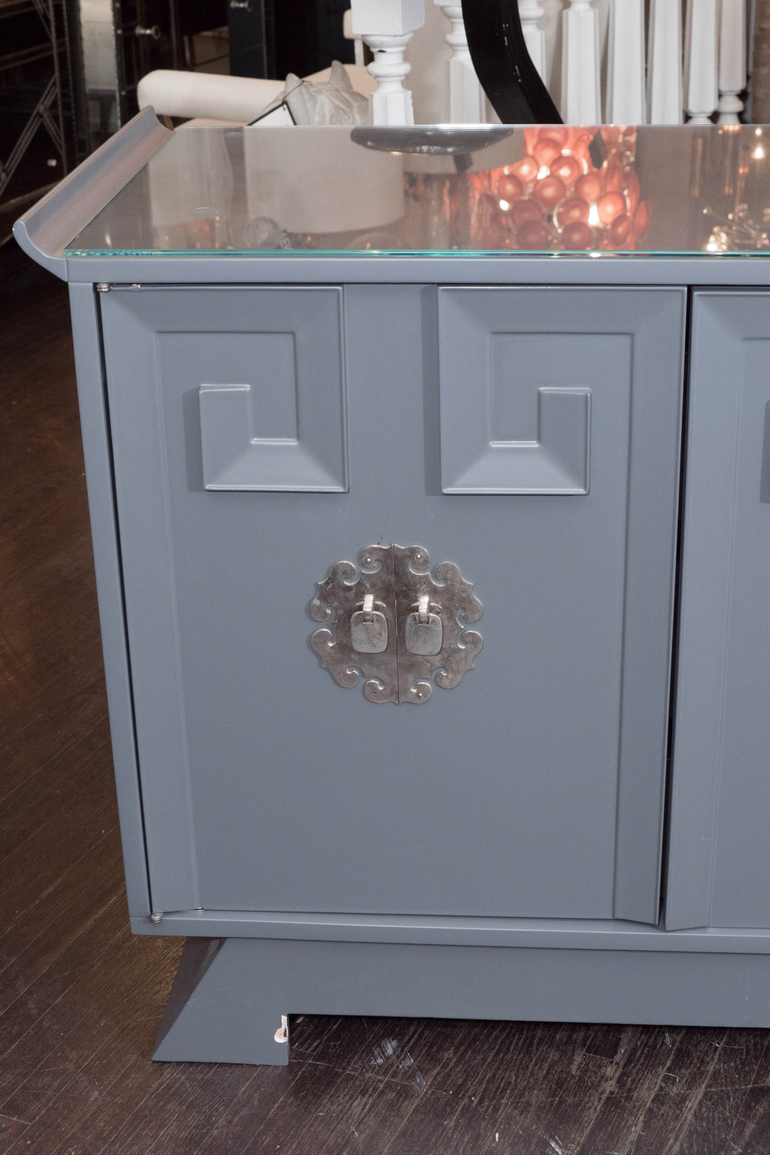 Vintage grey satin lacquer side board with glass top and Greek key detail.