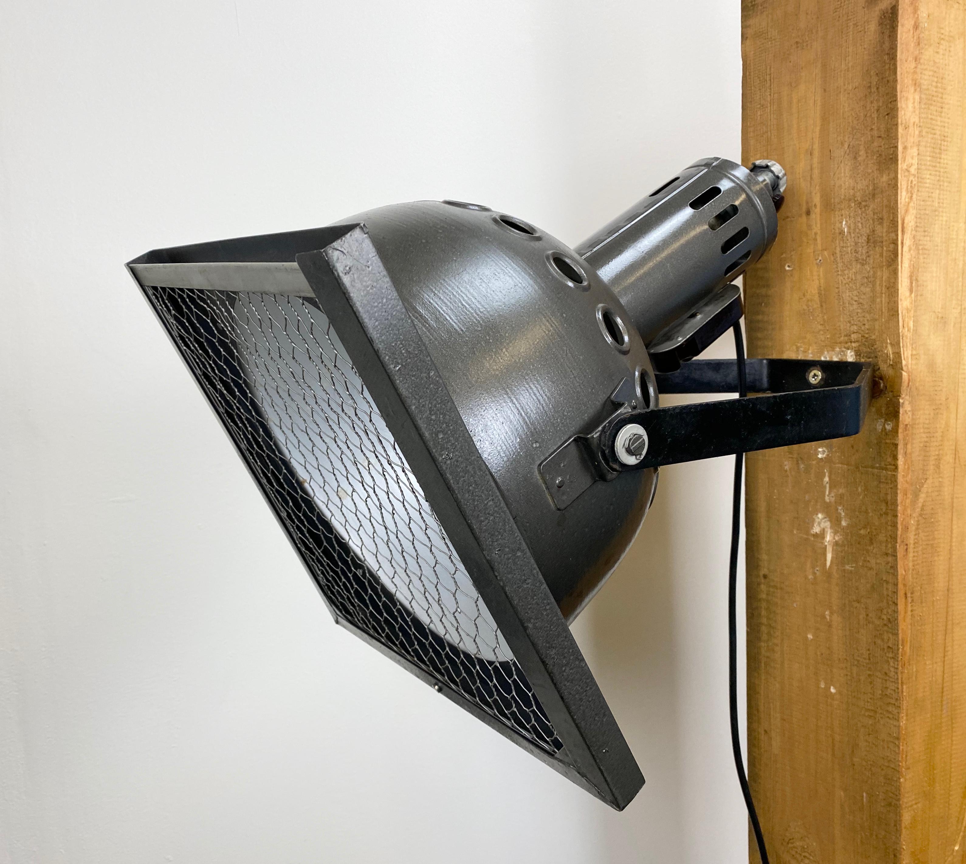 - Vintage theatre wall spotlight made in former Czechoslovakia during the 1960s 
- It features metal grey hammerpaint body and iron grid
- Socket for E27 lightbulbs and new wire 
- The weight of the spotlight is 5 kg 
- Fully functional, good