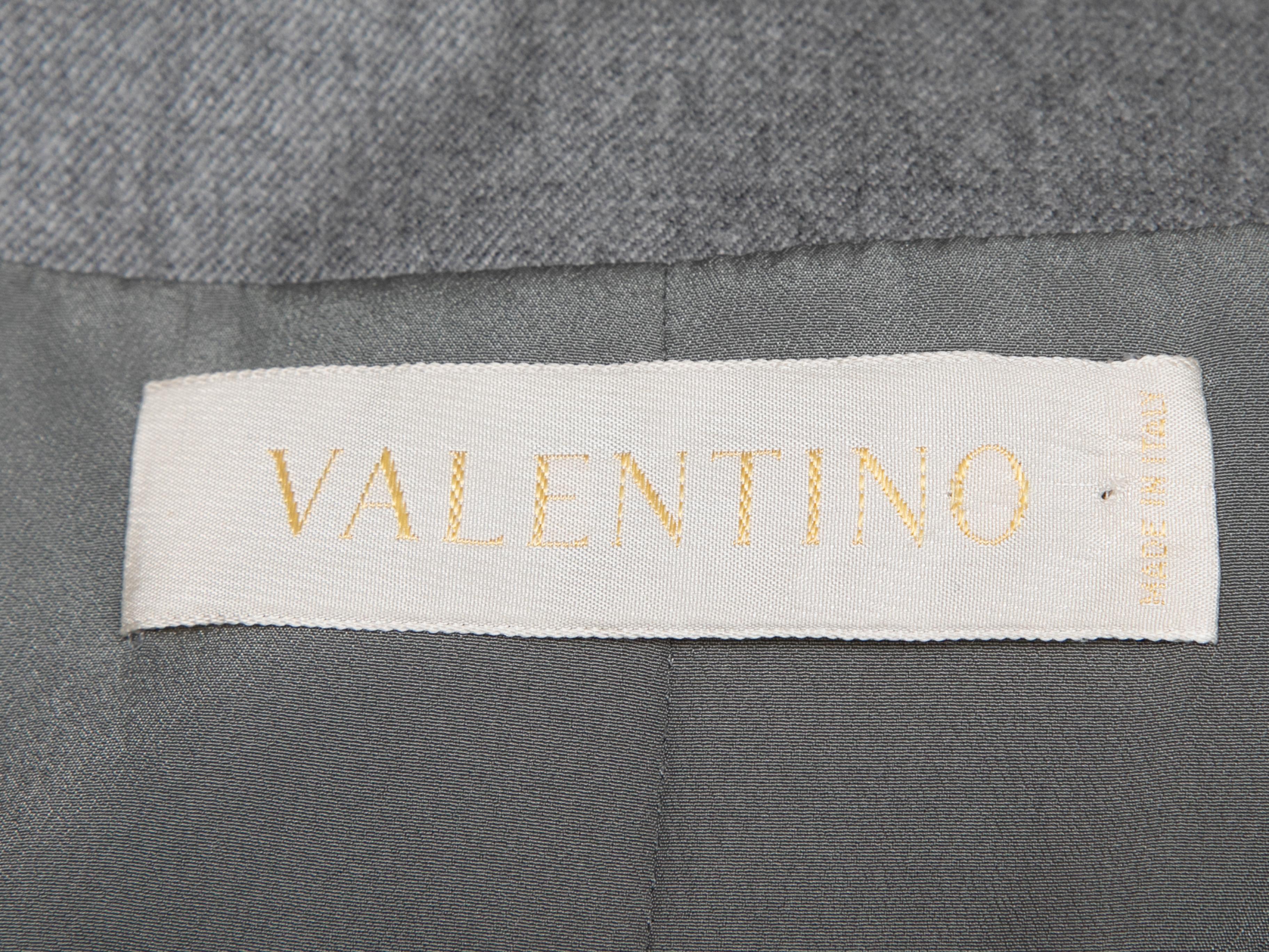 Vintage grey wool and cashmere jacket by Valentino. Rhinestone embellishment trim. V-neck. Zip closure at center front. 36