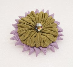 Vintage Grogue green and lila Brooch from MOSCHINO whith a central Crystal