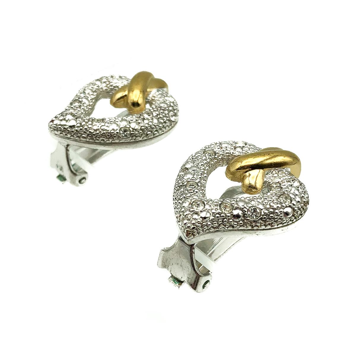 Adorable vintage Grossé earrings. Featuring a Stylised heart in silver pave set with crystals and finished with a gold kiss atop the heart. 
About Grossé: Henkel & Grossé are world class producers of costume jewellery. As esteemed German jewellers