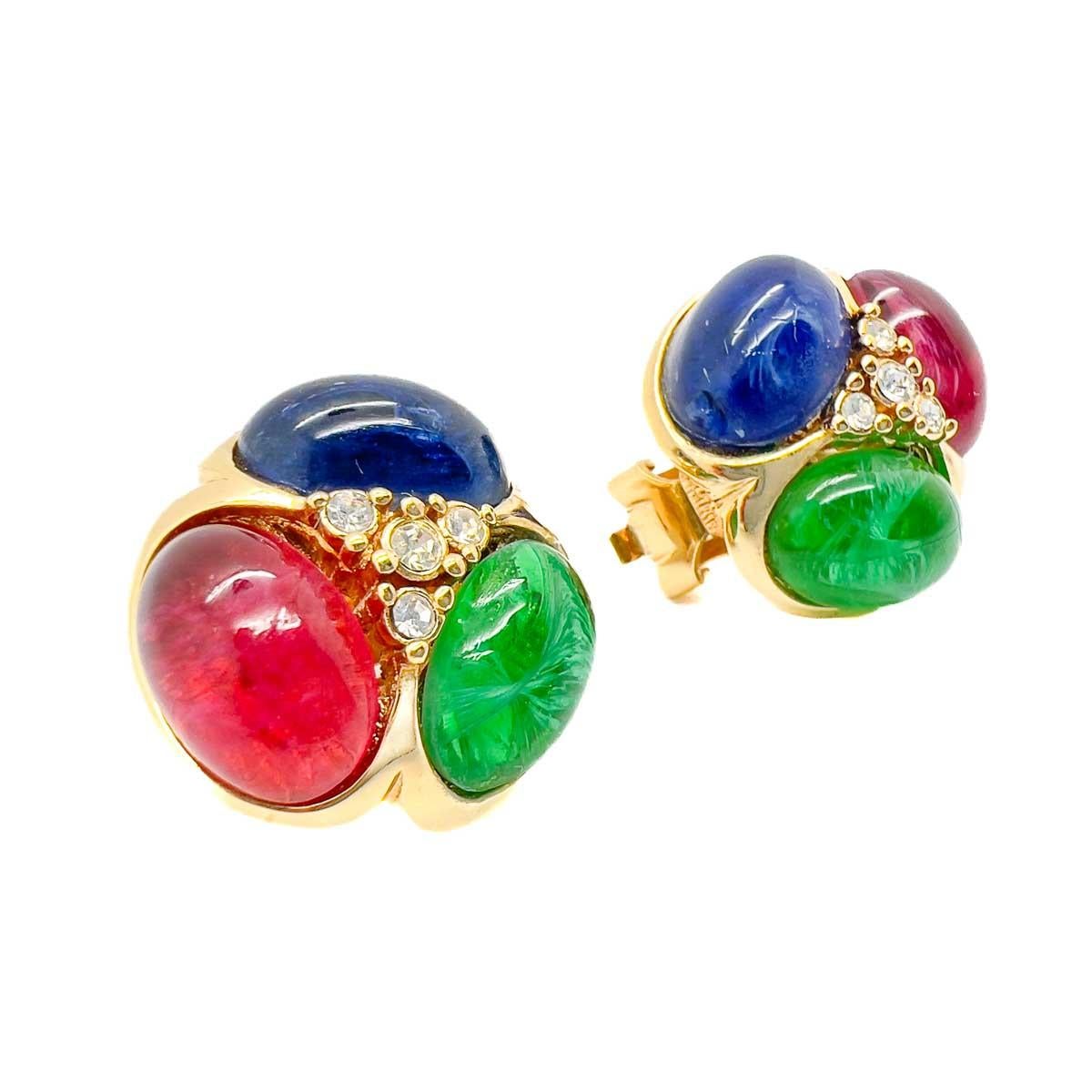 A pair of Vintage Grossé Cabochon Earrings. Heavenly jewel coloured glass cabochons imitate flawed precious stones including sapphire, ruby and emerald. The epitome of chic, timeless style.
From modernist to centuries old styles, premiere German