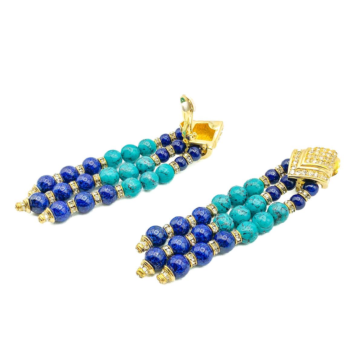 A stunning example of Henkel & Grossé's superior costume jewellery work is to be found in these vintage Grossé Tassle Earrings. A trio of long line drops are created from lapis lazuli and turquoise effect glass beads hung from a diamond shape clip