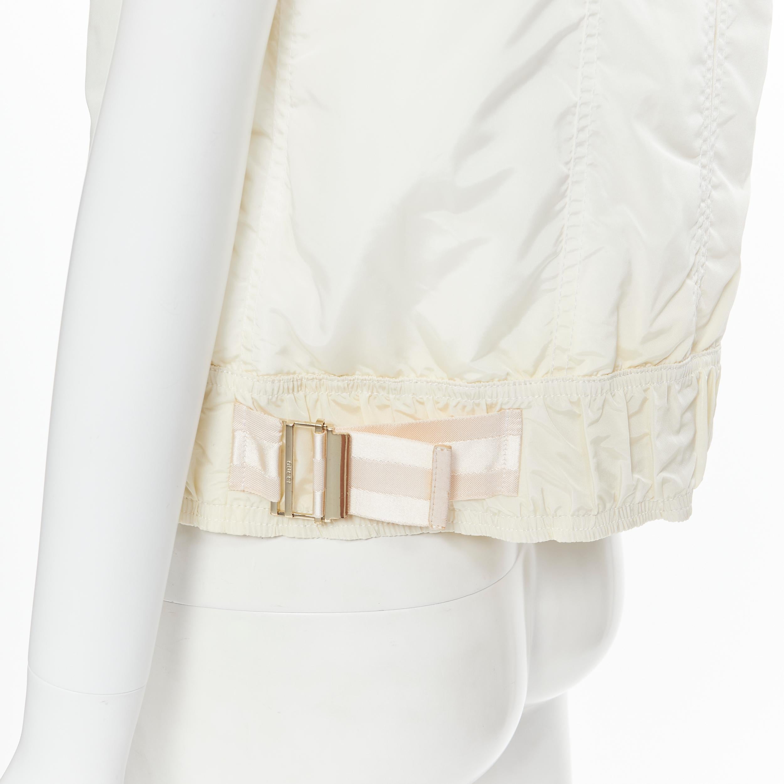 vintage GUCCI 2004 cream white oversized collar zip padded vest jacket IT42 M 
Reference: GIYG/A00078 
Brand: Gucci 
Material: Nylon 
Color: White 
Pattern: Solid 
Closure: Zip 
Extra Detail: Padded puffer vest. Pink webbing buckle detailing. Zip