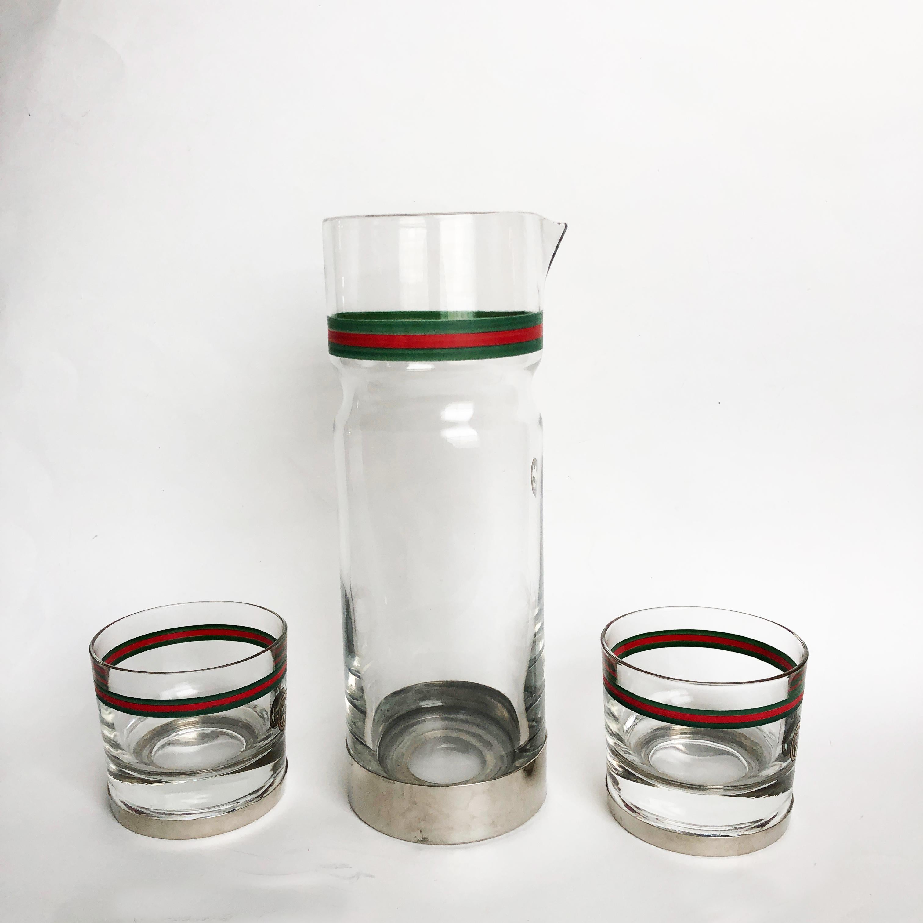 Entertain in style! Authentic, preowned, vintage Gucci 3pc barware set: GG Logo Webbing Pitcher or Carafe with 2 whiskey/old-fashioned glasses. Painted glass on silver metal base. Preowned/vintage with some signs of prior use/wear: some scratching