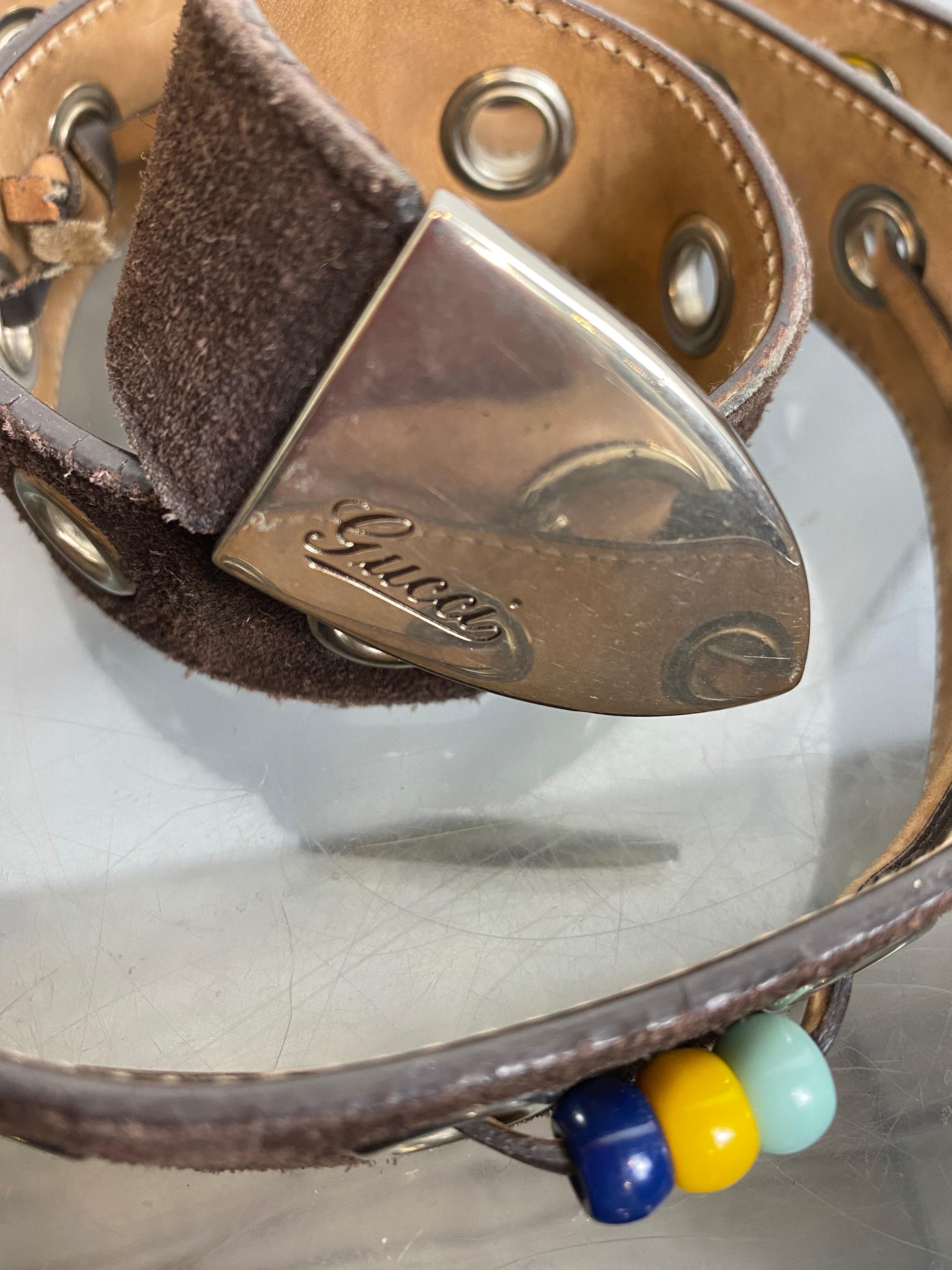 Vintage Gucci belt in dark brown suede with colored beads and steel details. 
It has normal signs of wear but overall in good condition. 

Total length 109 cm 
Last hole length 94 cm
Height 3 cm 