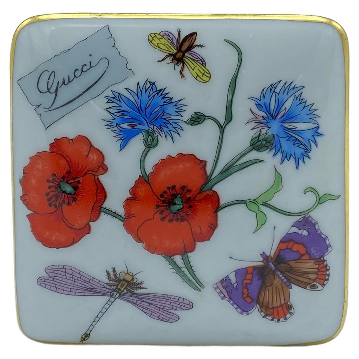 TheRealList presents: a stunning vintage Gucci porcelain box. This box features the classic Gucci 'flora' pattern which depicts wild flowers and insects. From the 1980s this item was produced by Bernardaud Limoges for Gucci. This porcelain