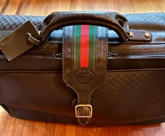 Vintage Gucci black canvas and leather suitcase