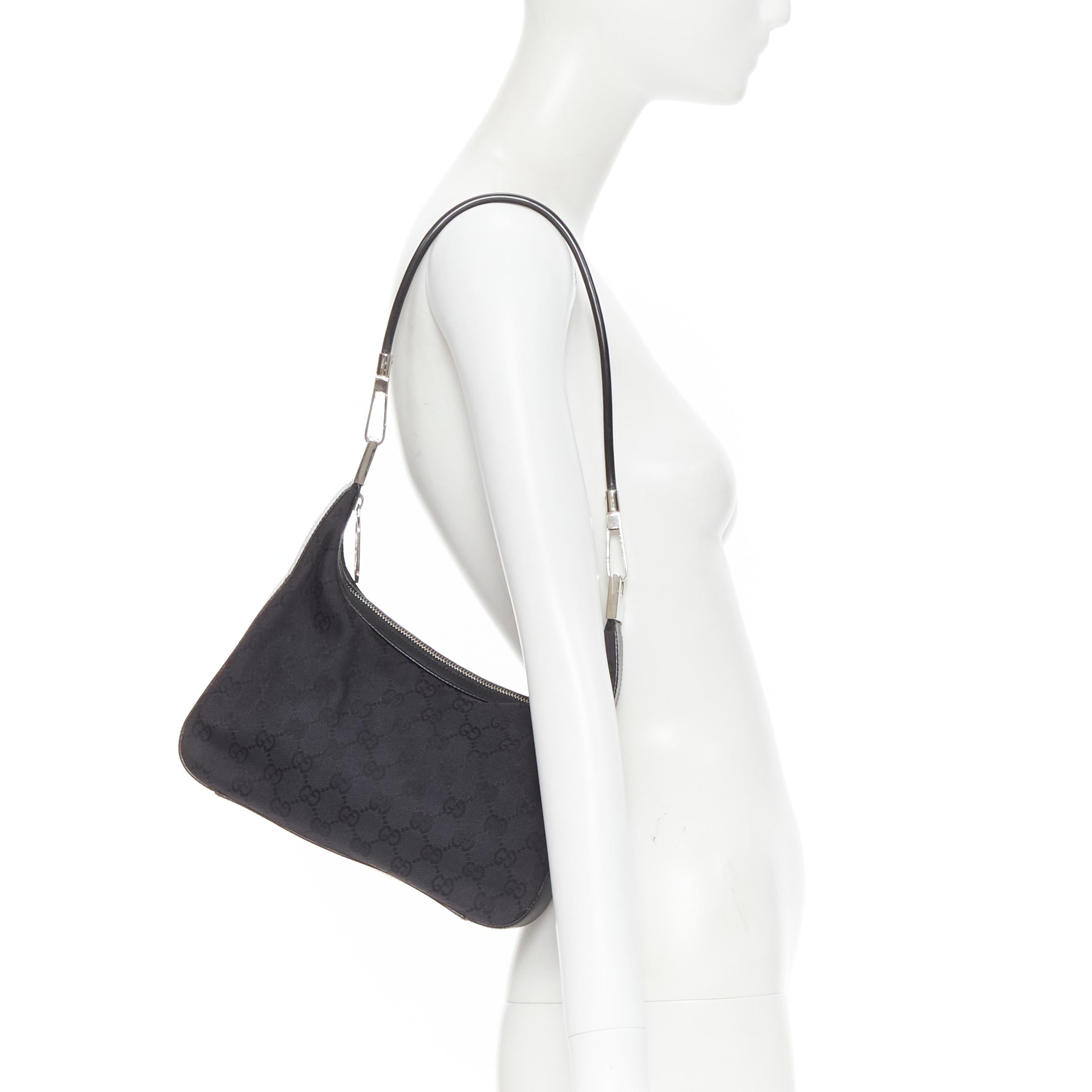 vintage GUCCI black GG monogram canvas leather trim silver wire shoulder hobo 
Reference: KNCN/A00010 
Brand: Gucci 
Model: Wired handle hobo 
Material: Canvas 
Color: Black 
Pattern: Solid 
Closure: Zip 
Extra Detail: Black GG canvas. Leather