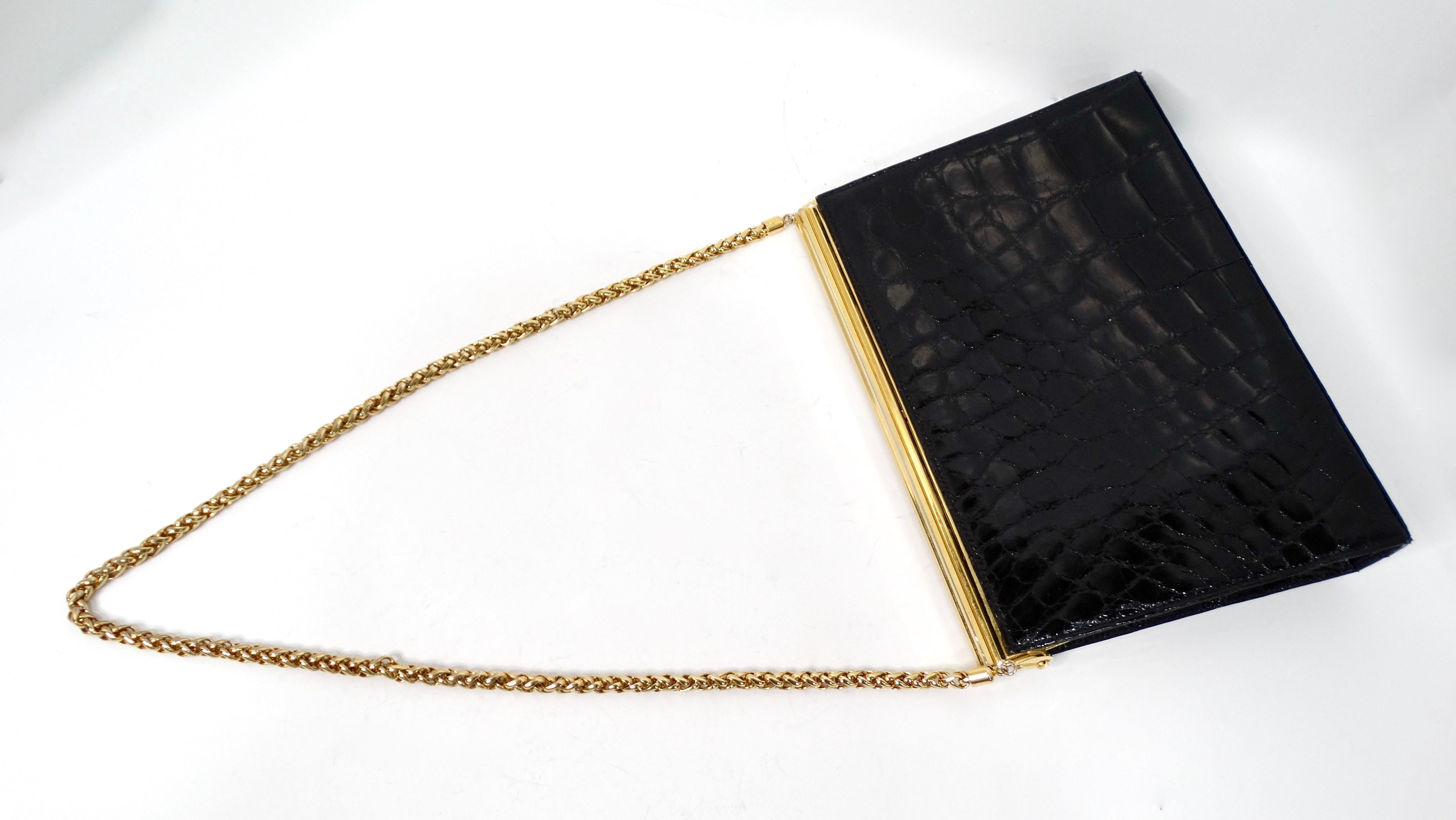 Introducing the Vintage Gucci Black Patent Crocodile Embossed Leather Structured Handbag, a stunning blend of elegance and luxury. This exquisite piece showcases a bold patent finish with an intricate crocodile embossed design, capturing attention